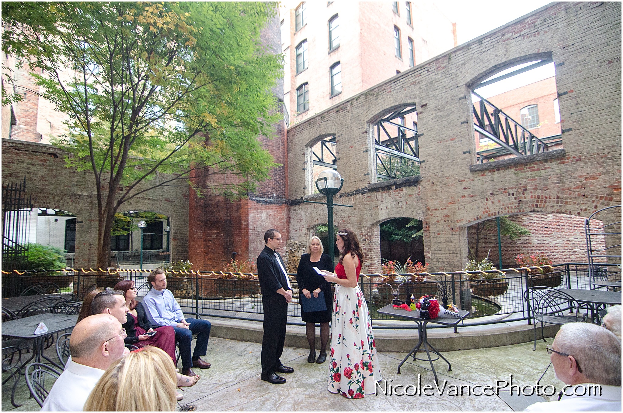 Wedding ceremony at Bookbinders on the back patio.