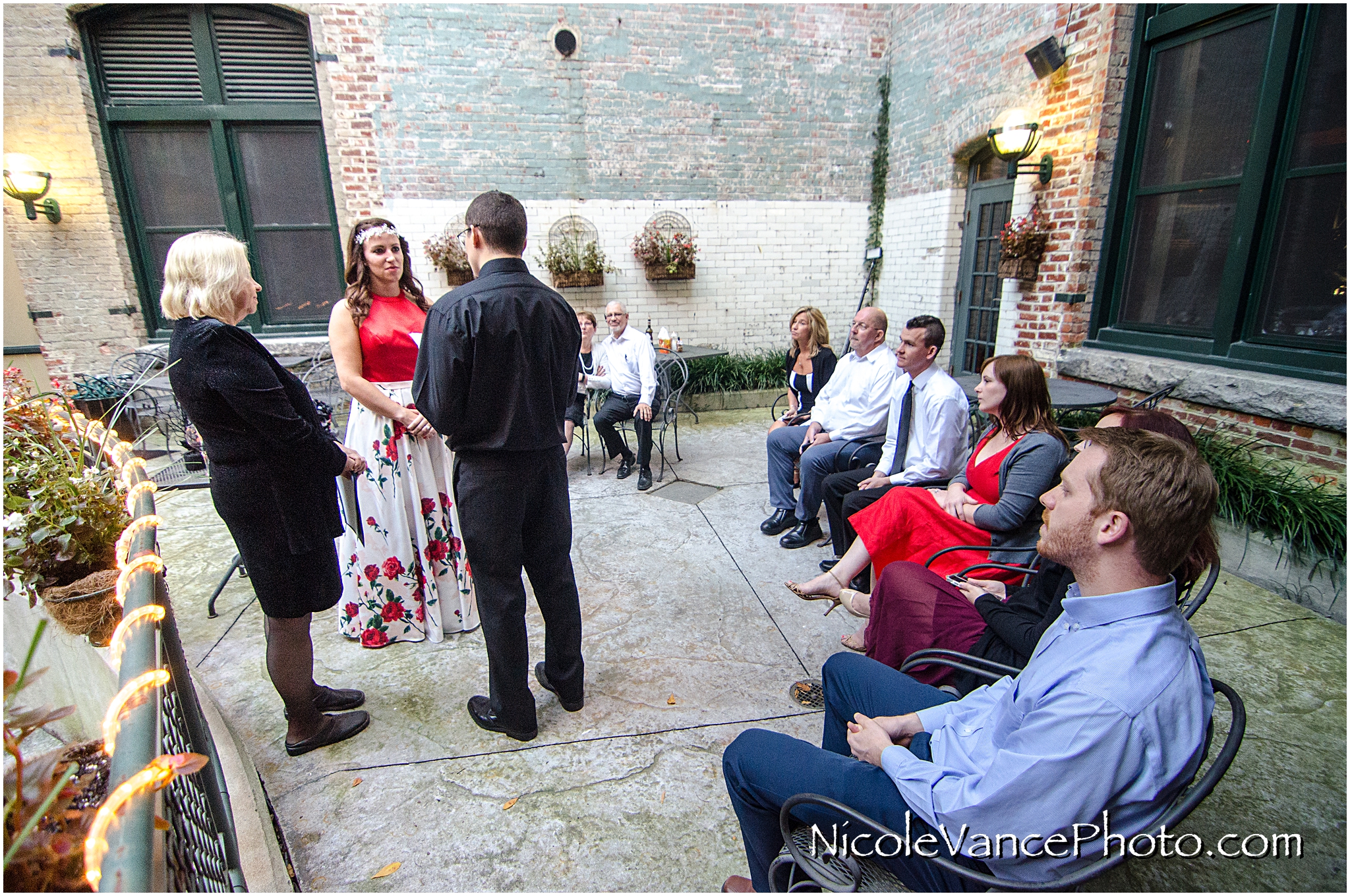 Wedding ceremony at Bookbinders on the back patio.