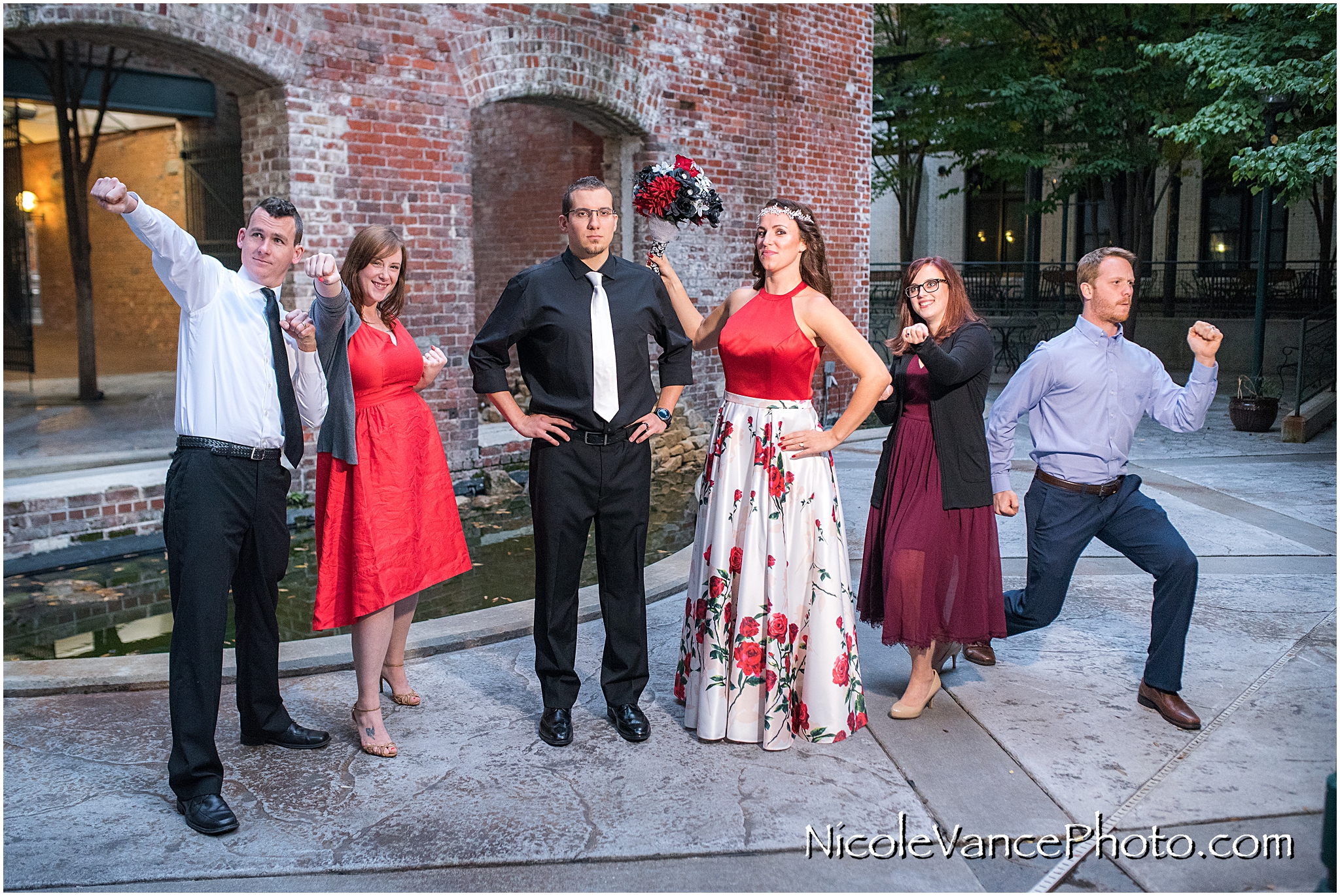 The friends pose as superheroes after a Micro-Wedding at Book Binders in Richmond VA.