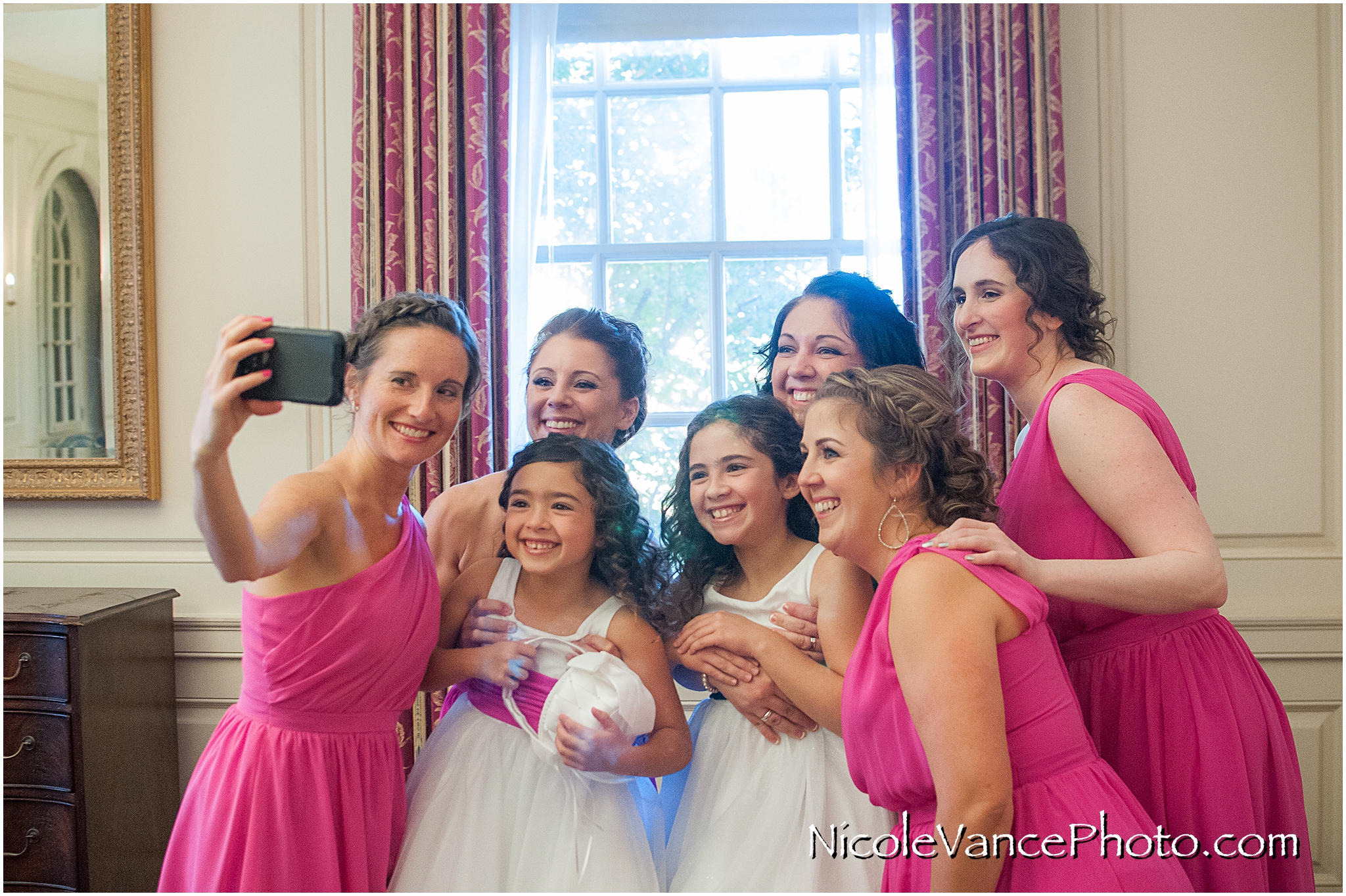 Members of the bridal party get together for a selfie in the conference room at Virginia Crossings.