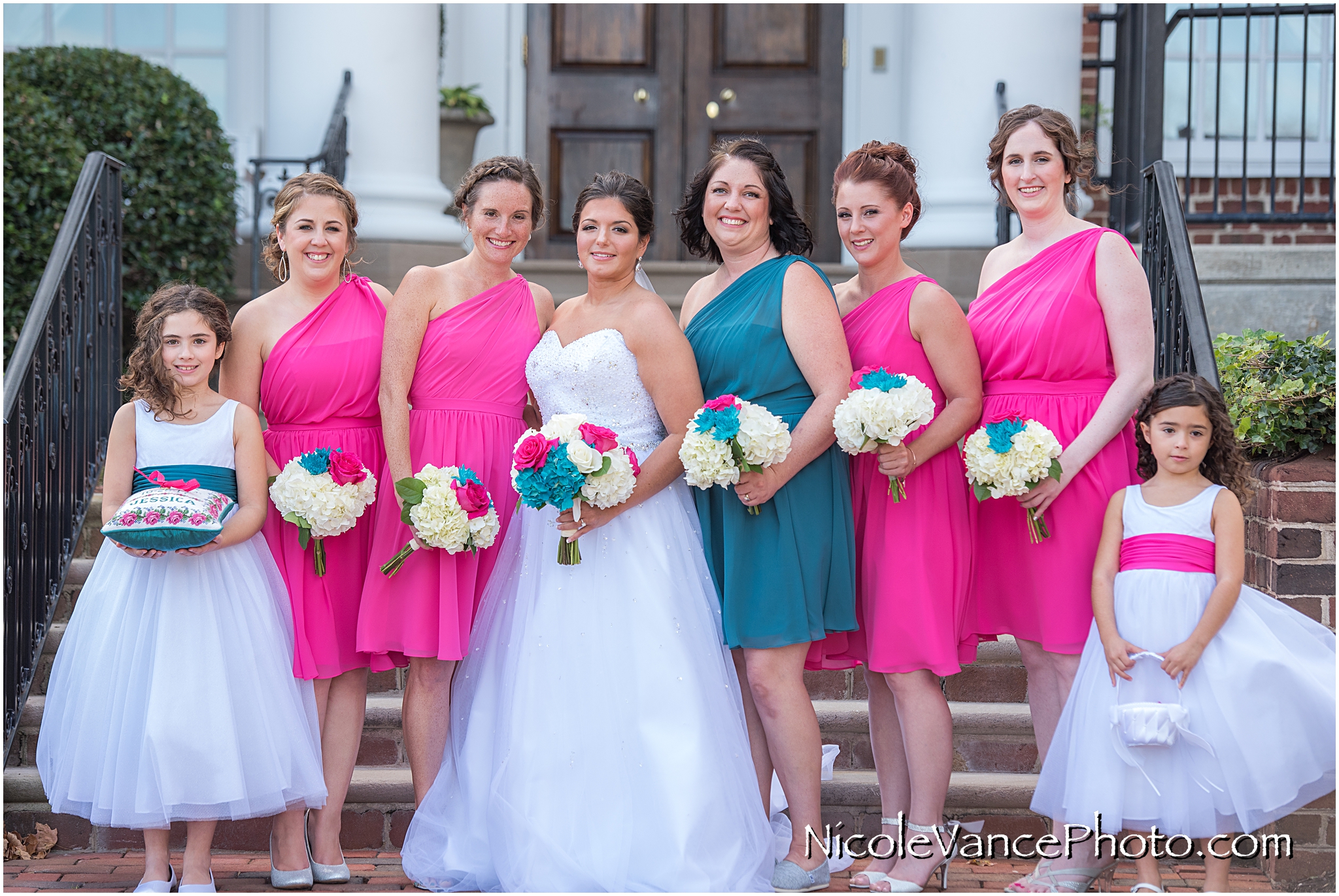 Bridal party portrait on the steps at Virginia Crossings.