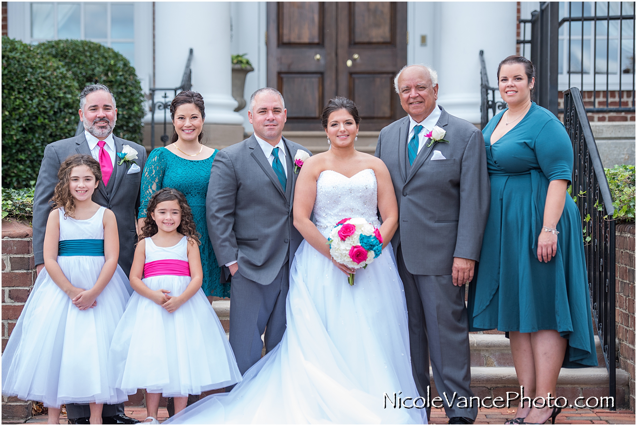 Family portraits on the steps at Virginia Crossings.