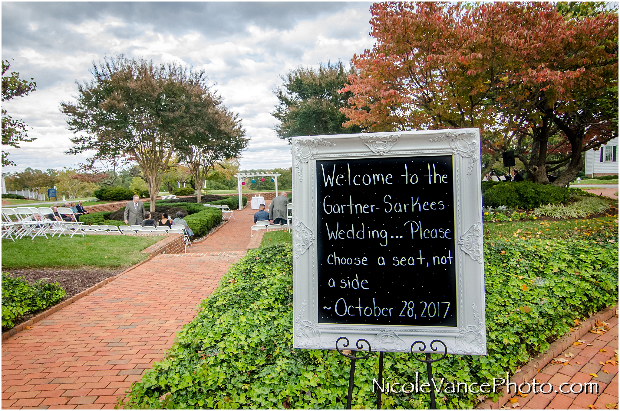 Wedding welcome sign sits at the entrance of the outdoor ceremony at Virginia Crossings.