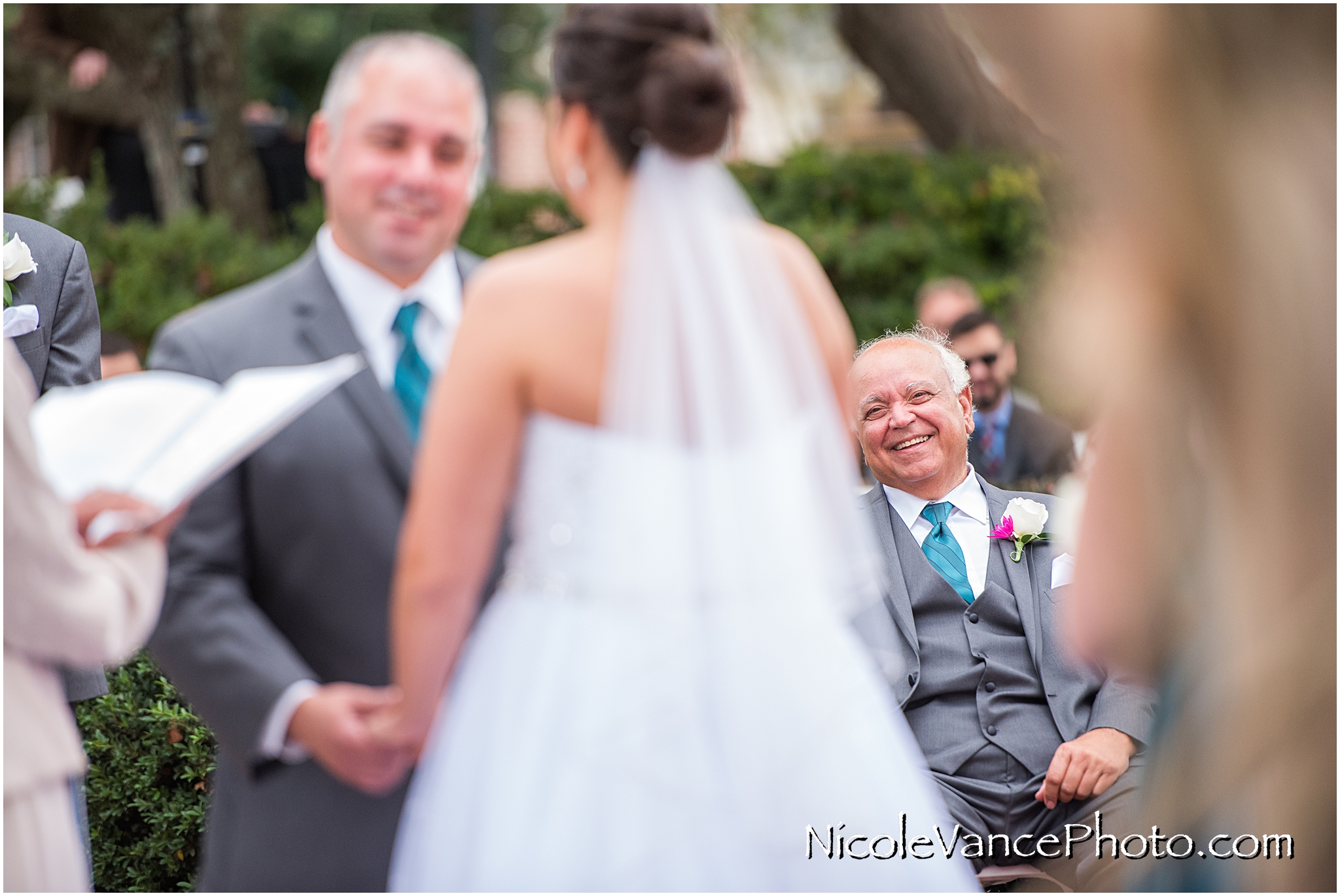 The groom's father during the wedding ceremony at Virginia Crossings.