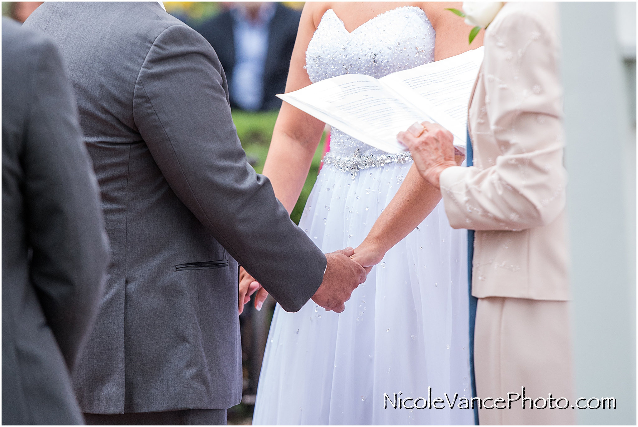 Phyllis Minn performs the wedding ceremony at Virginia Crossings.