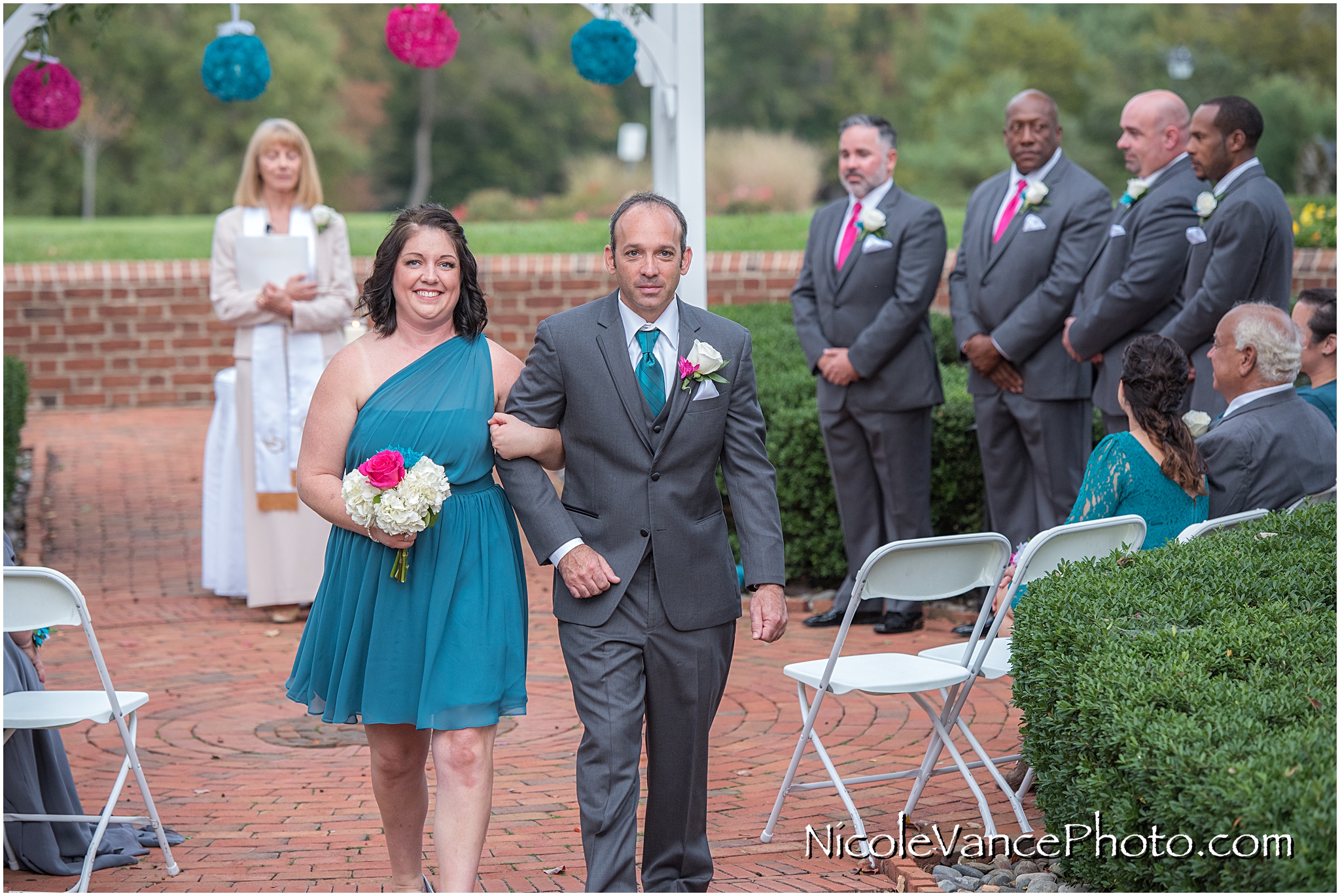 The wedding party exits the ceremony at Virginia Crossings.