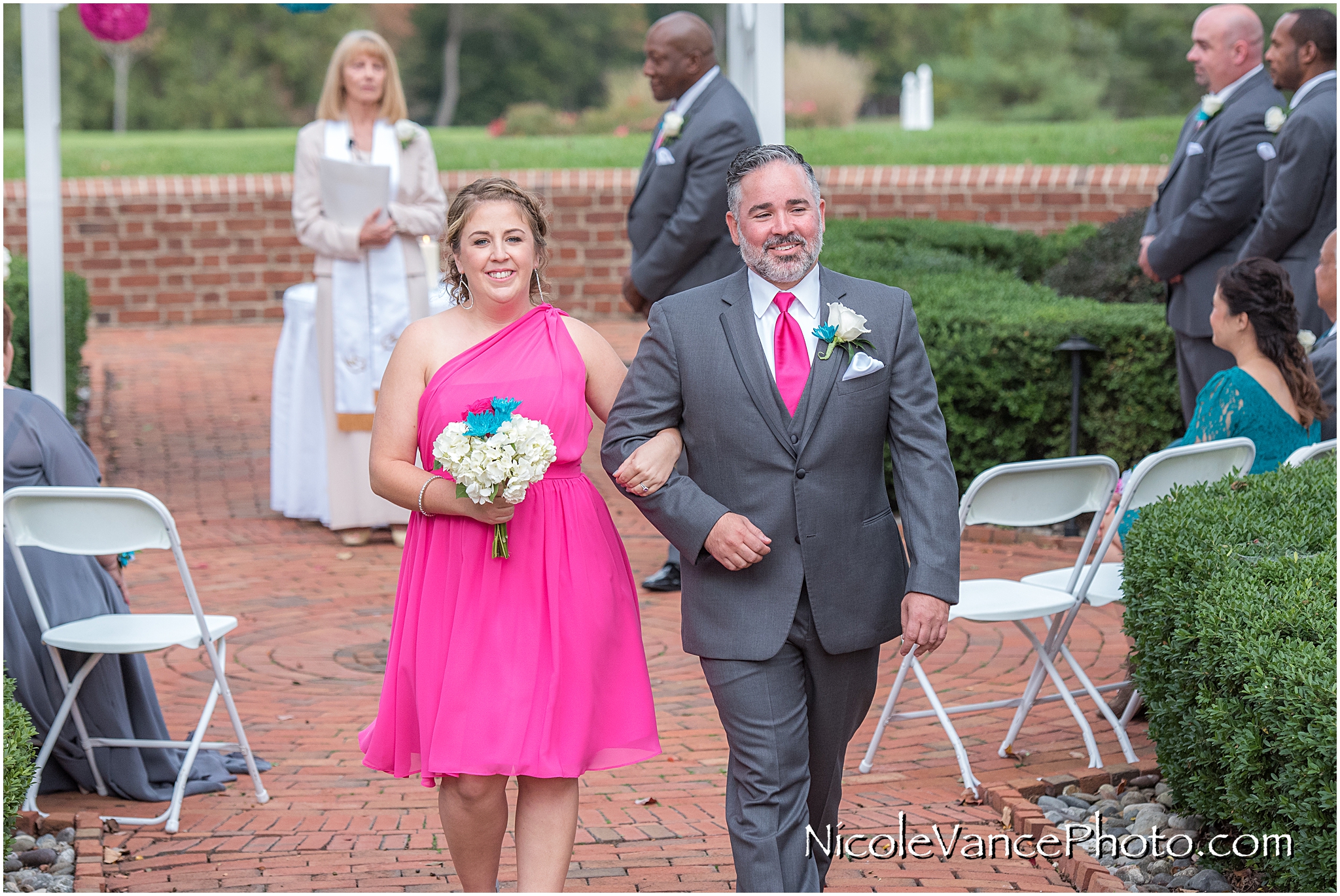 The wedding party exits the ceremony at Virginia Crossings.