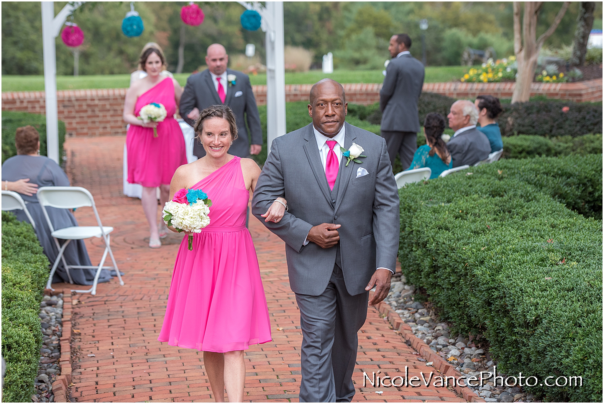 The wedding party exits the ceremony at Virginia Crossings.