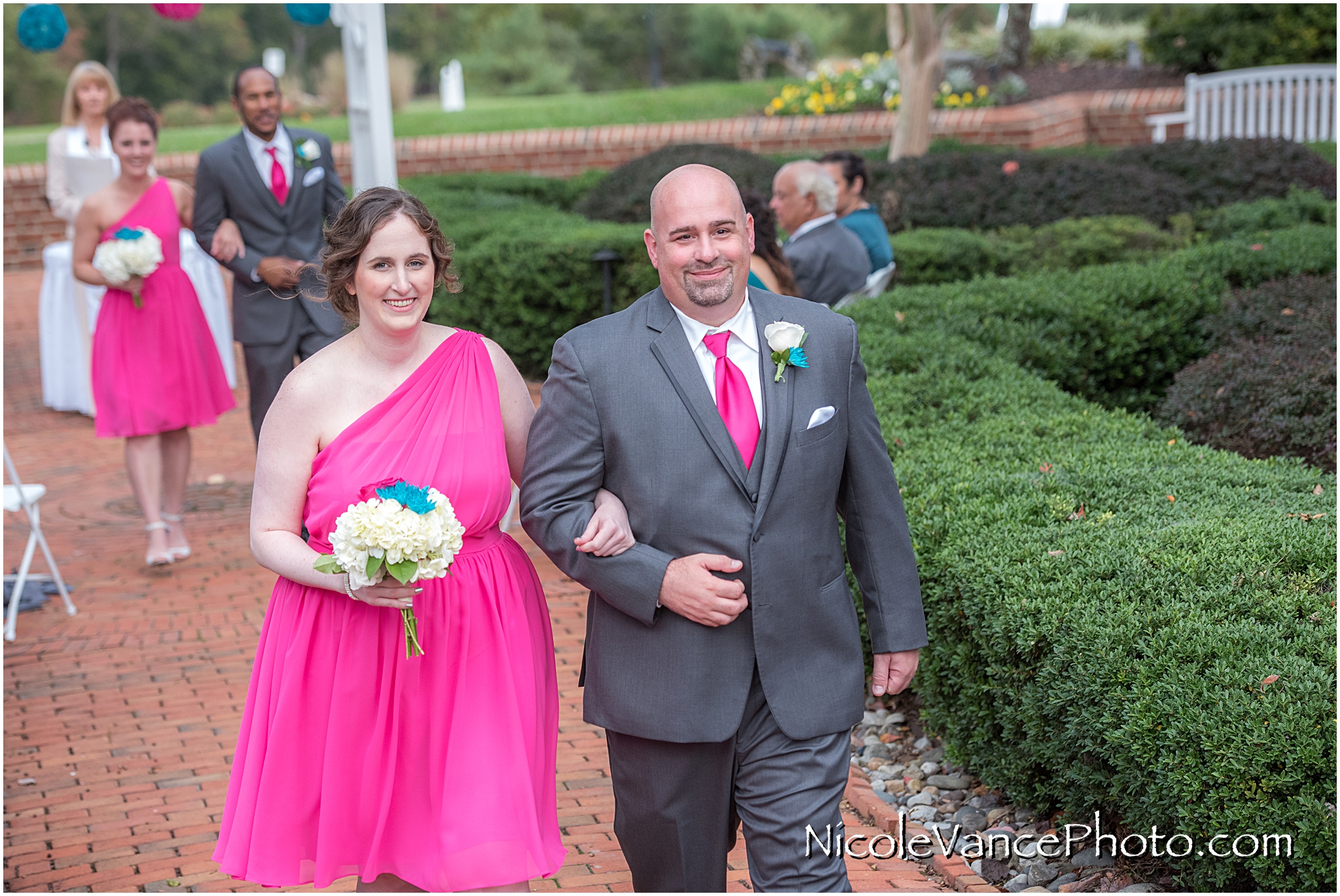 The wedding party exits the ceremony at Virginia Crossings.