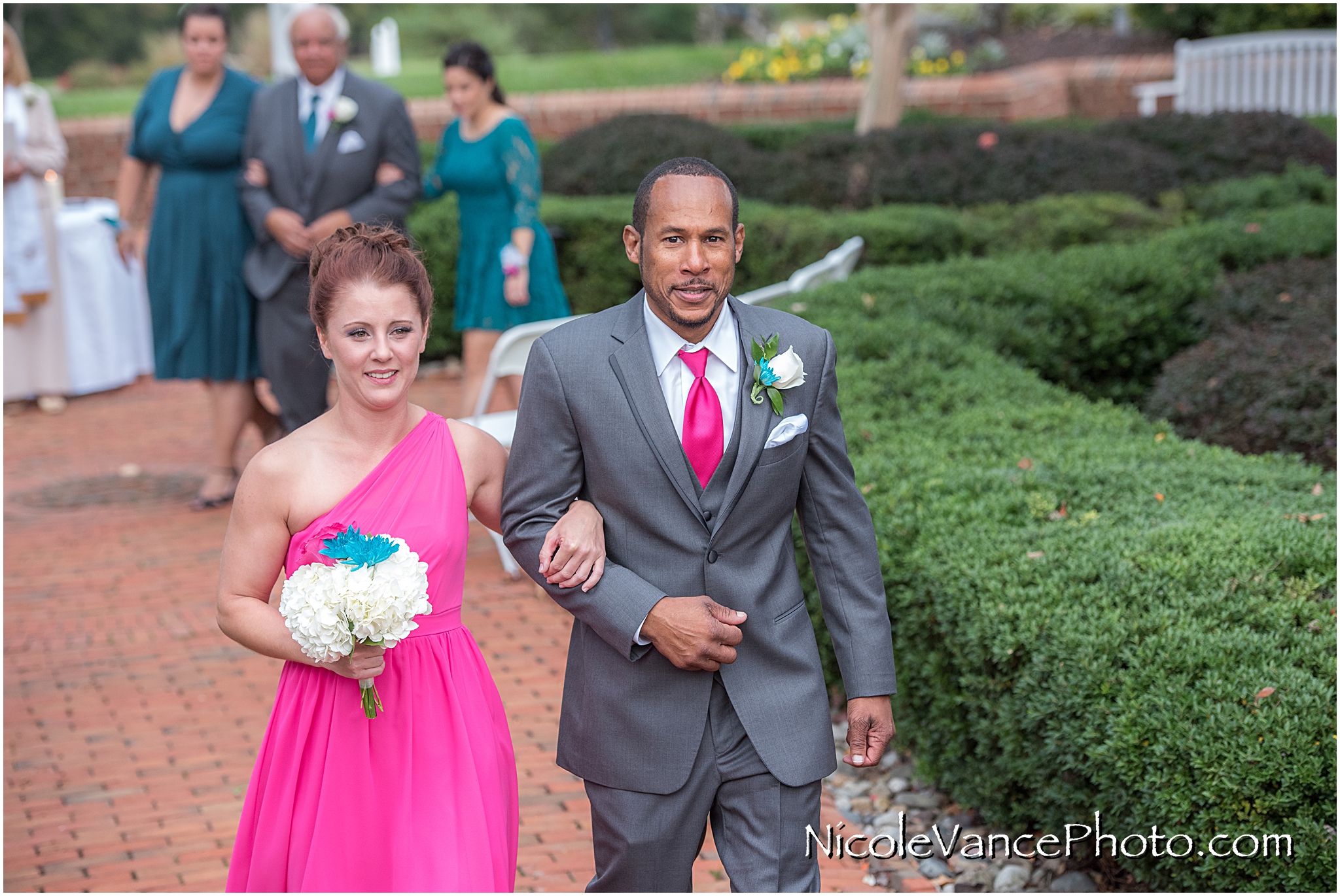 The wedding party exits the ceremony at Virginia Crossings.