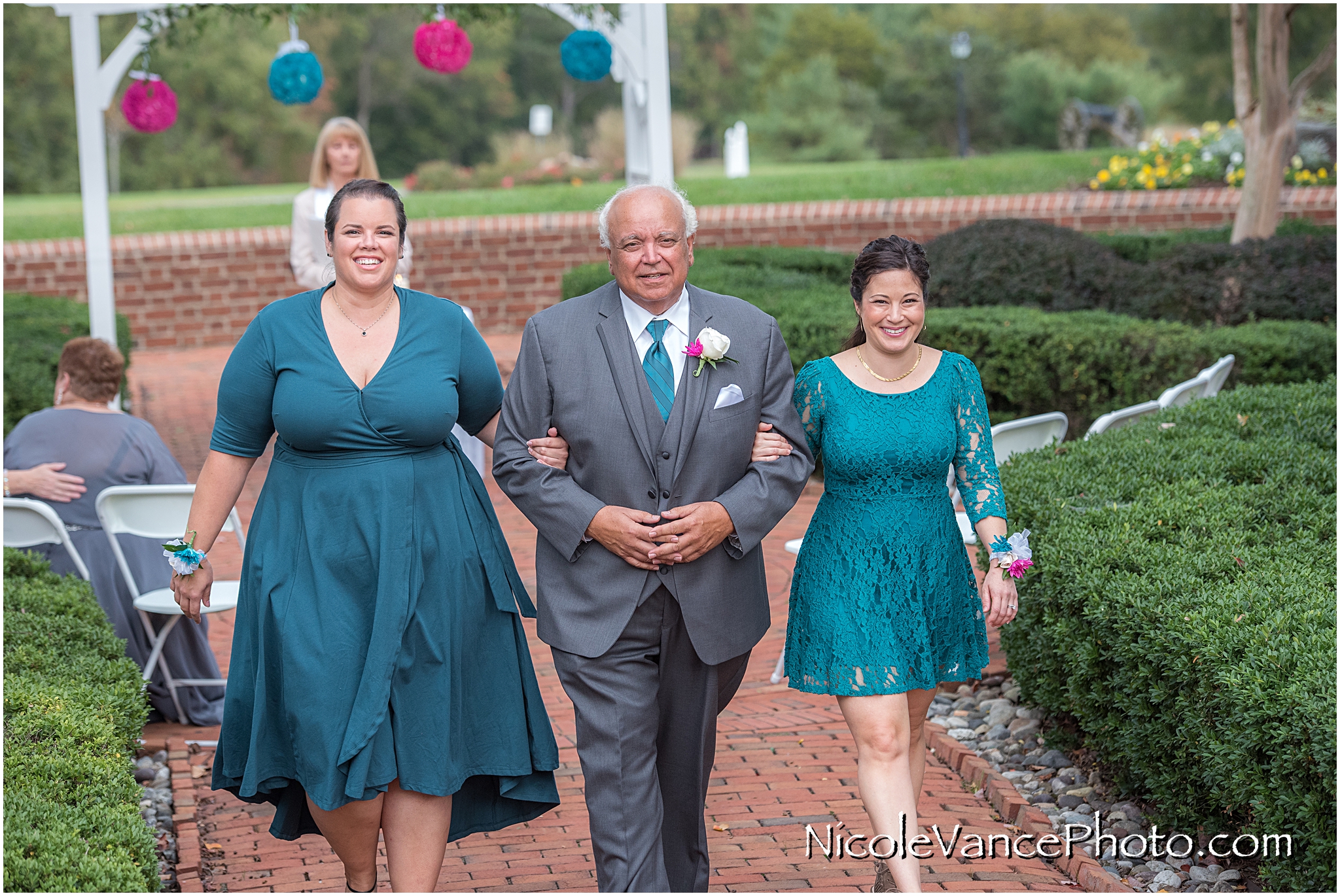 The family exits the ceremony at Virginia Crossings.