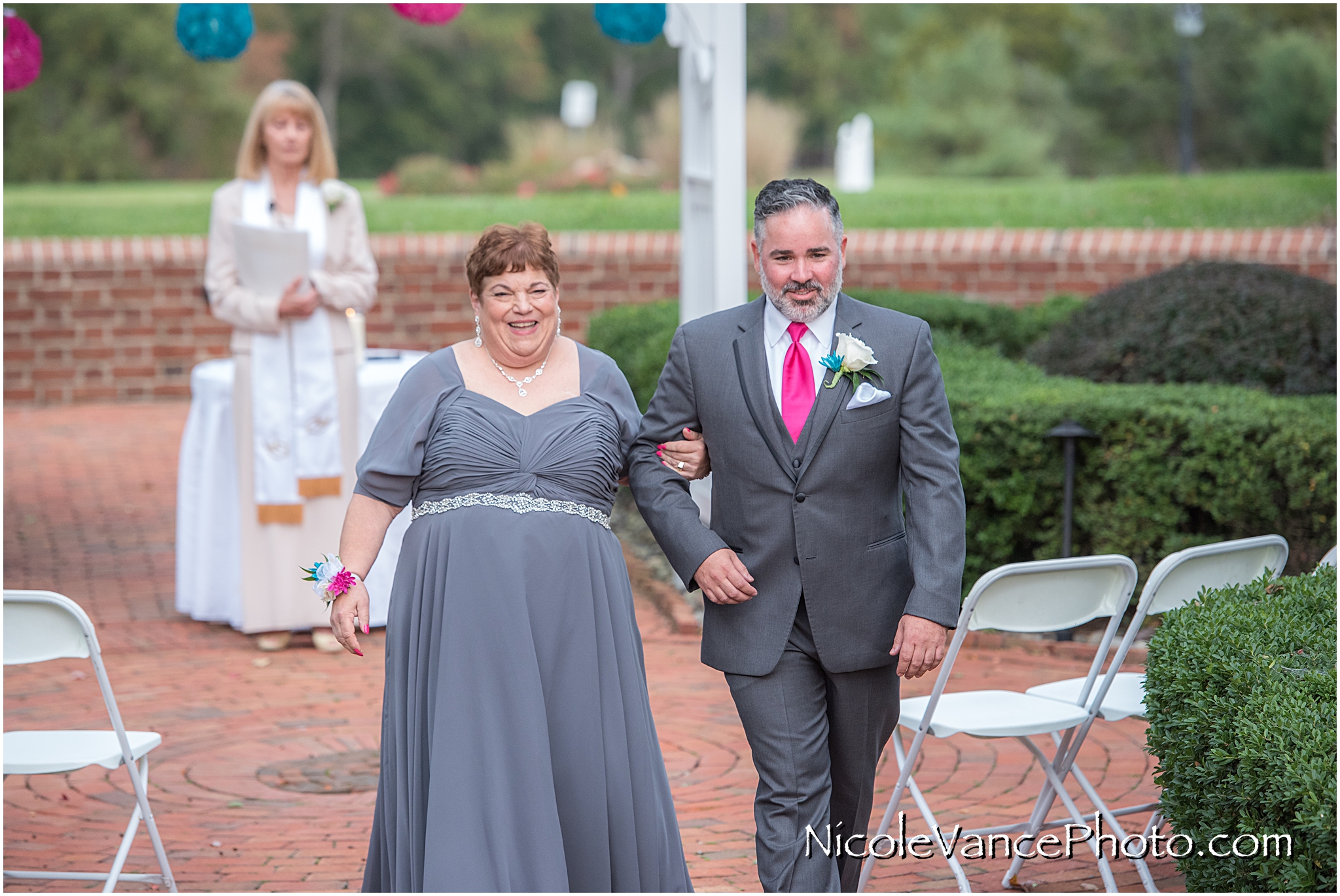 The family exits the ceremony at Virginia Crossings.