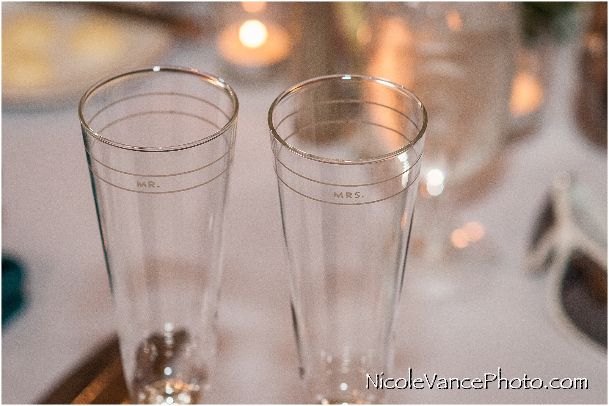 Mr & Mrs champagne glasses at the reception in the ballroom at Virginia Crossings.