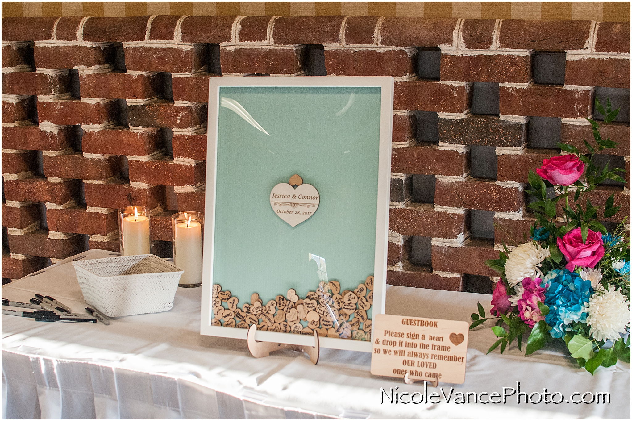 Sign a heart personalized wedding guestbook.