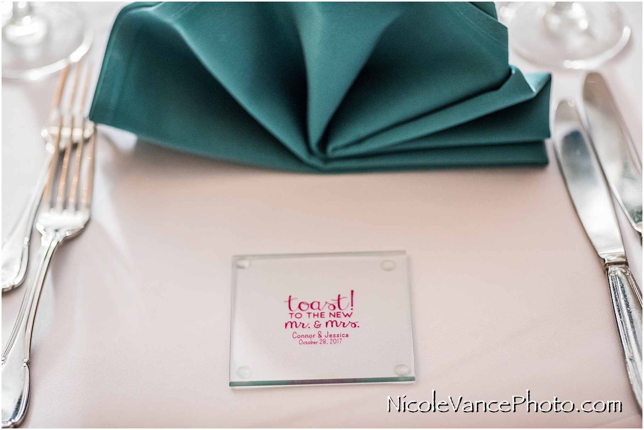 Wedding favors are personalized glass coasters.