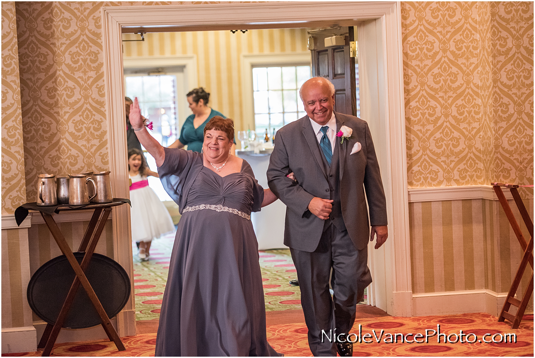 Family and Bridal party enter the Wedding Reception at Virginia Crossings.