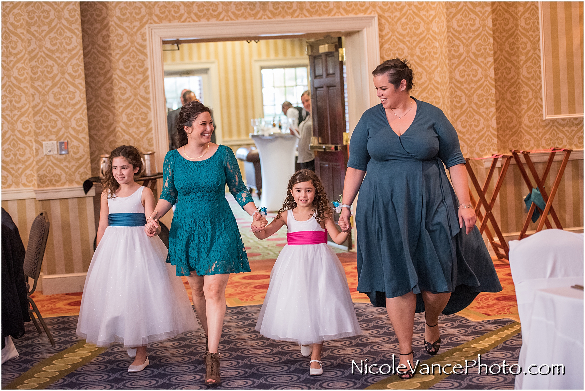 Family and Bridal party enter the Wedding Reception at Virginia Crossings.