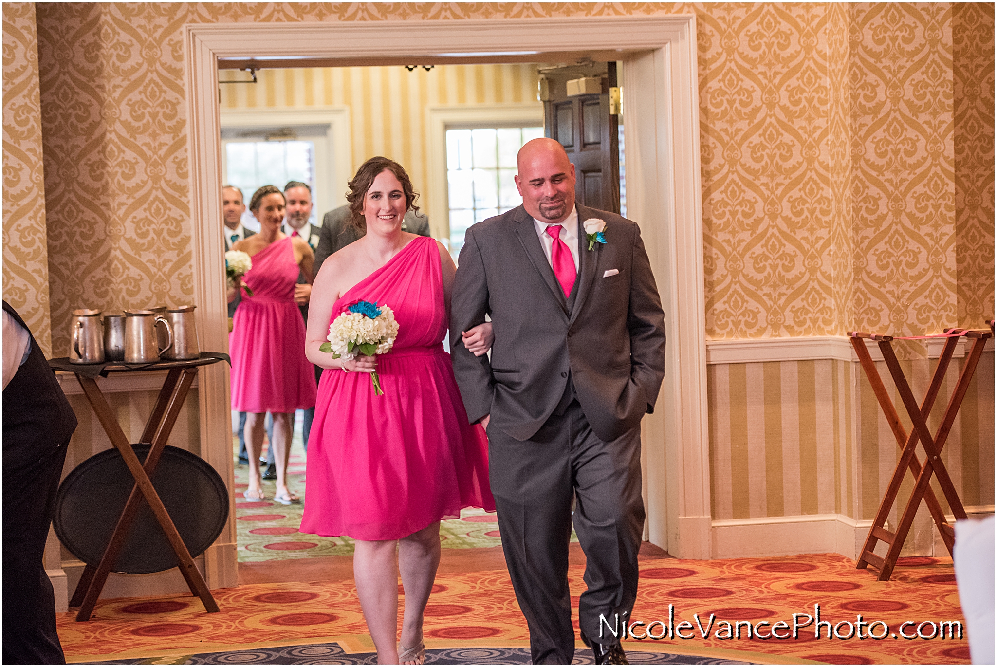 Family and Bridal party enter the Wedding Reception at Virginia Crossings.