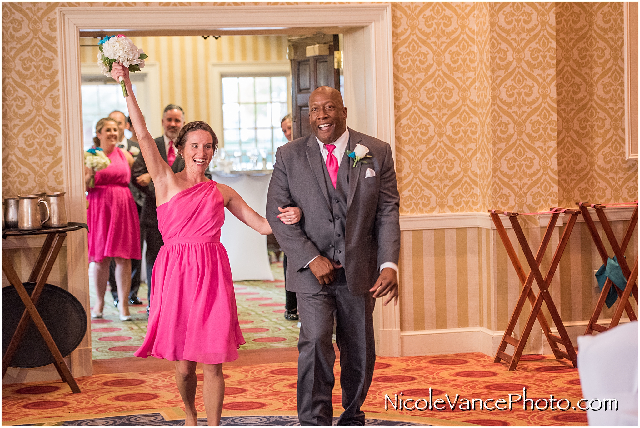 Family and Bridal party enter the Wedding Reception at Virginia Crossings.