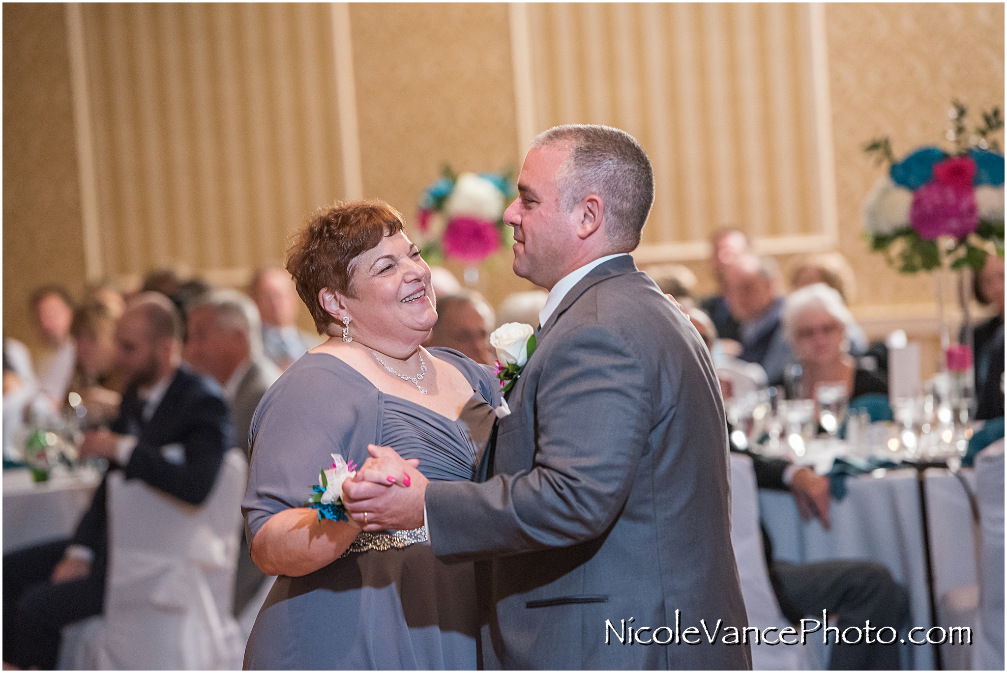 The groom dances with his new mother in law in the ballroom at Virginia Crossings.