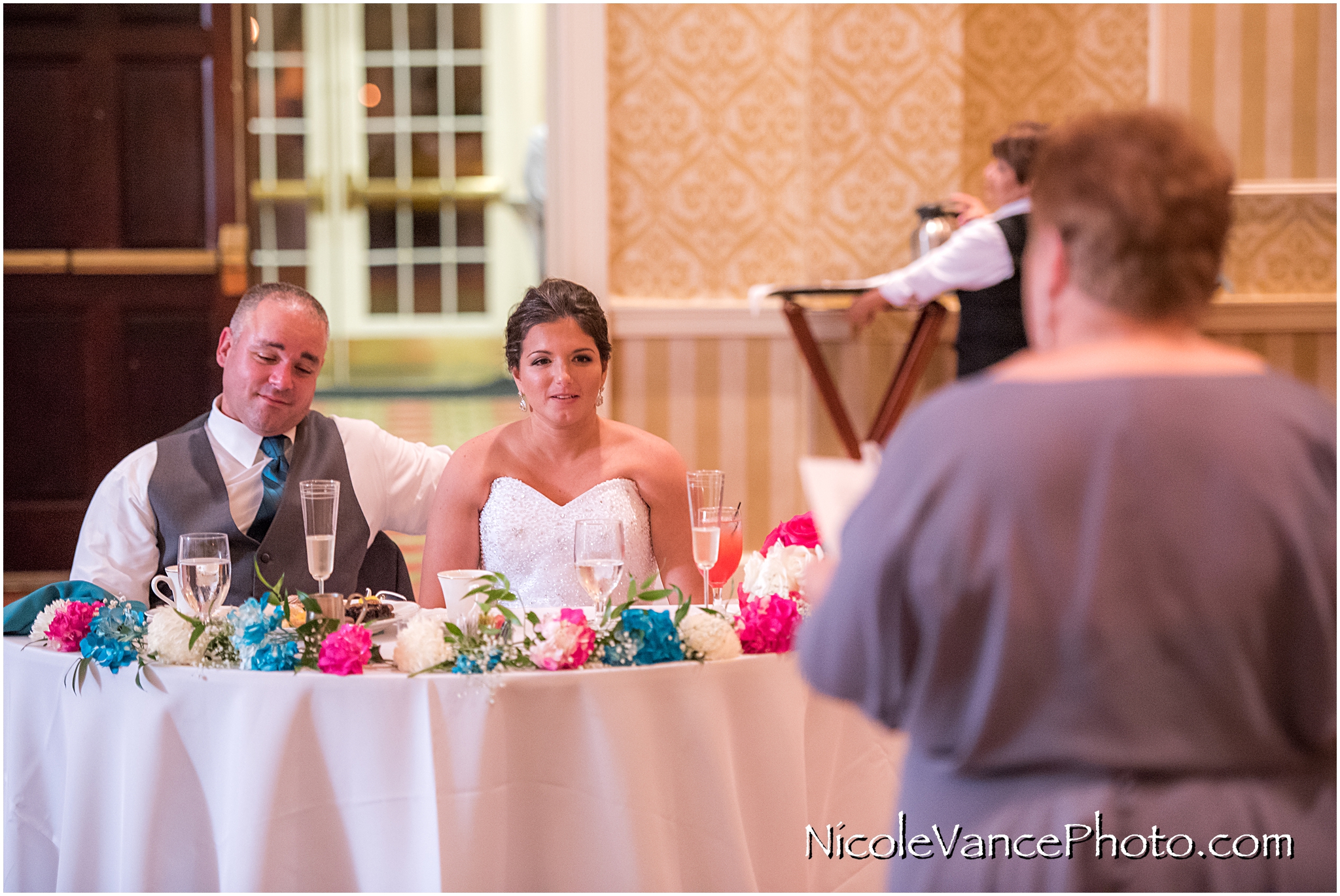 The bride's mom makes a toast at the reception at the Virginia Crossings.