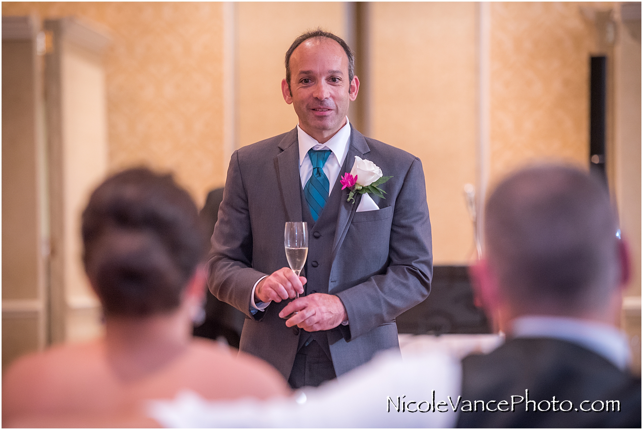 The best man makes a toast at the reception at the Virginia Crossings.