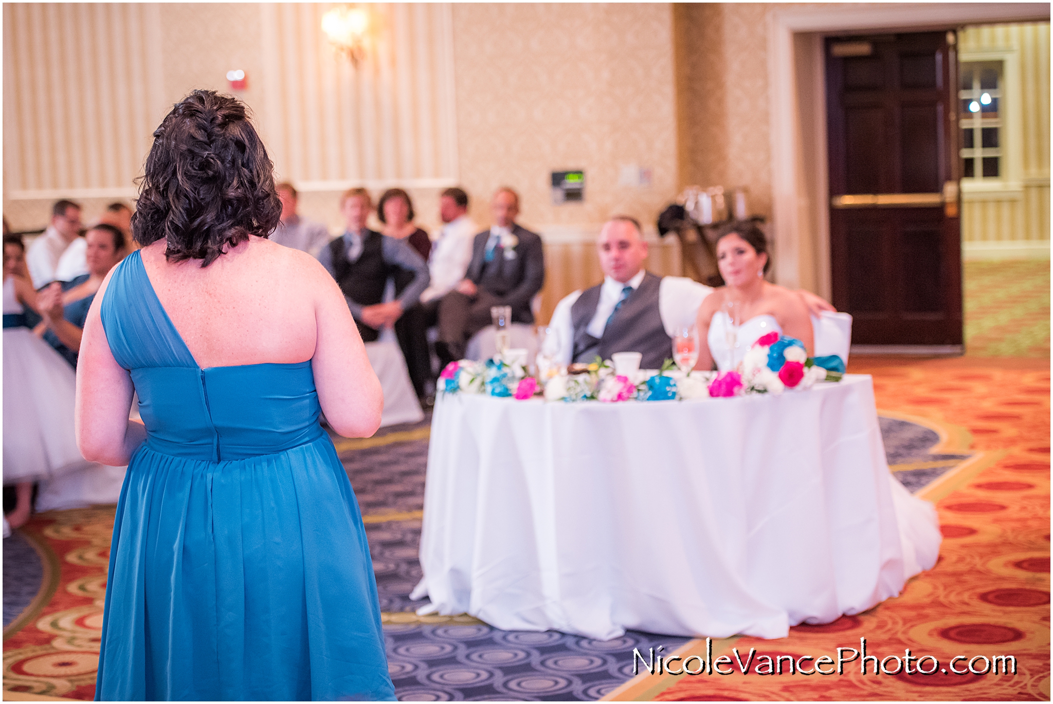 The maid of honor makes a toast at the reception at the Virginia Crossings.