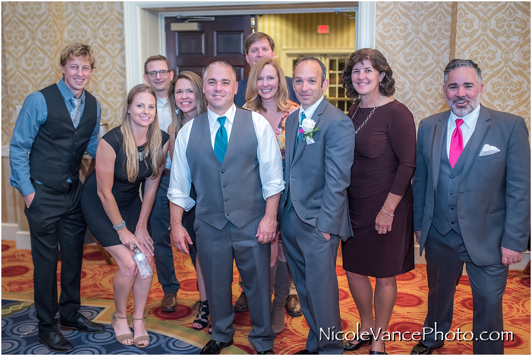 The groom poses with friends at Virginia Crossings.