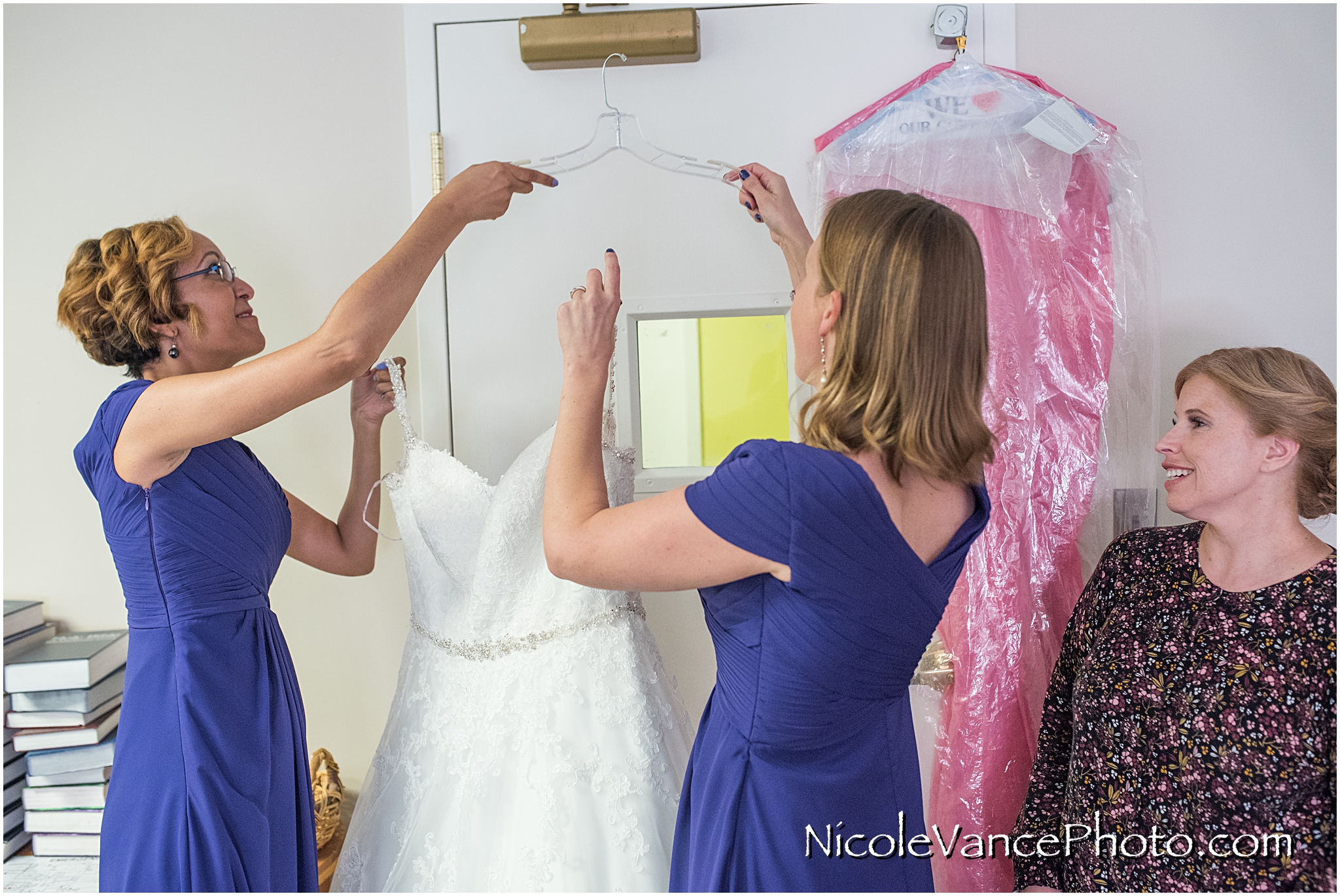 The bride is ready to put on her dress from Tiffany's Bridal.