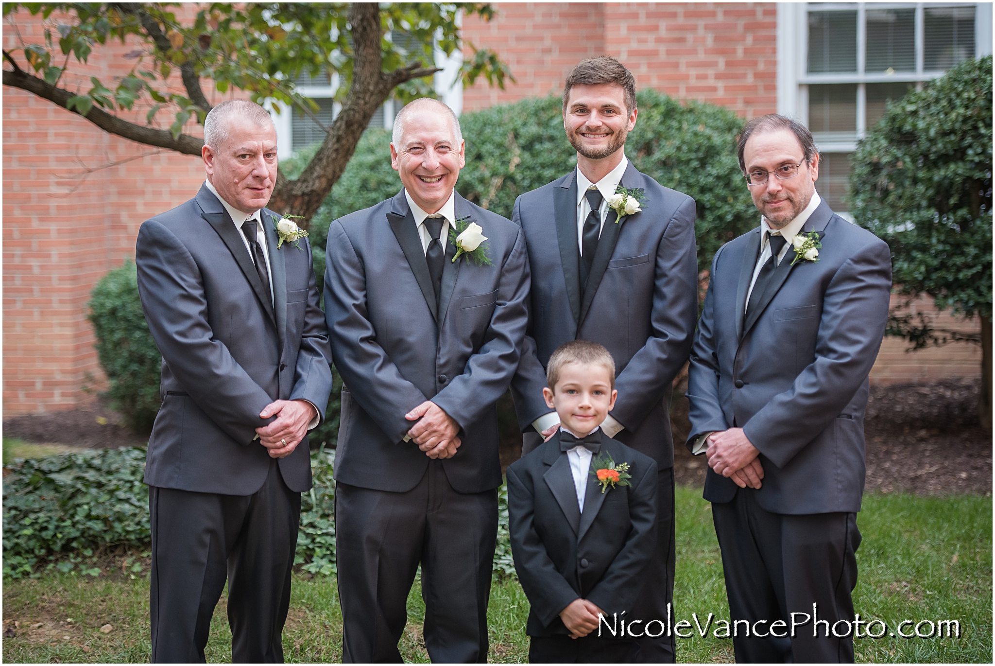 The groom poses with his groomsmen and ring bearer at Third Church, RVA.