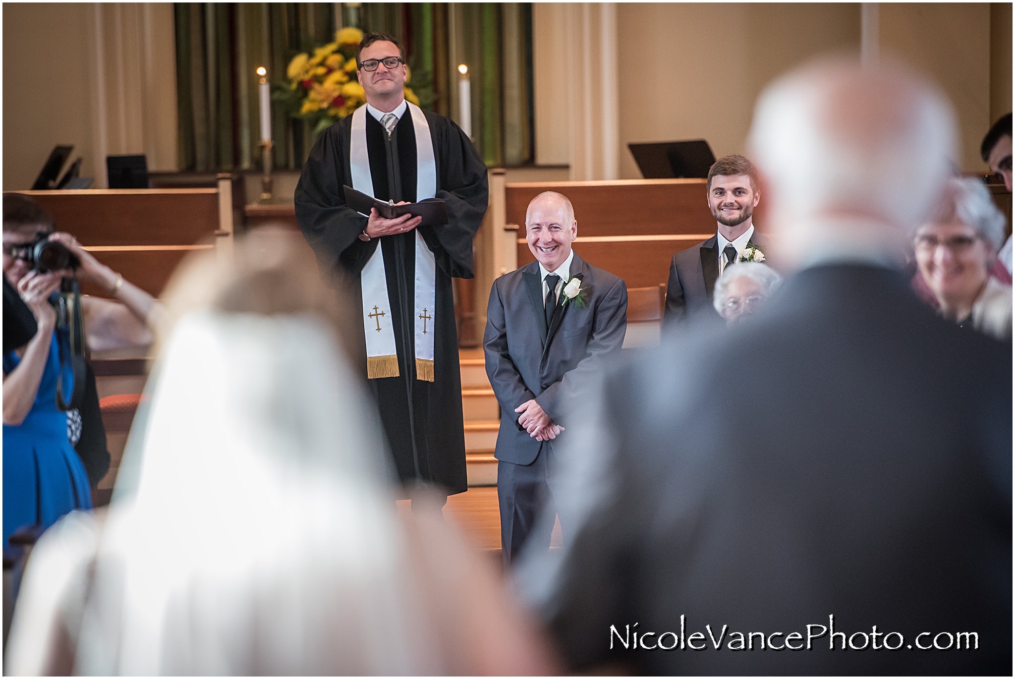 The groom sees his bride for the first time.