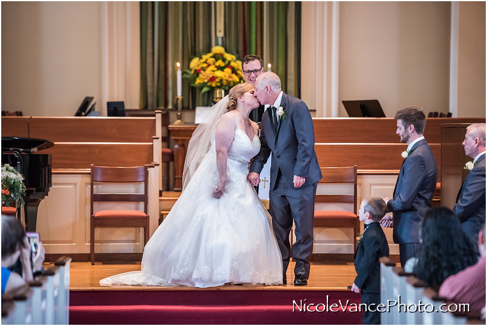 The couple has this first kiss as husband and wife.