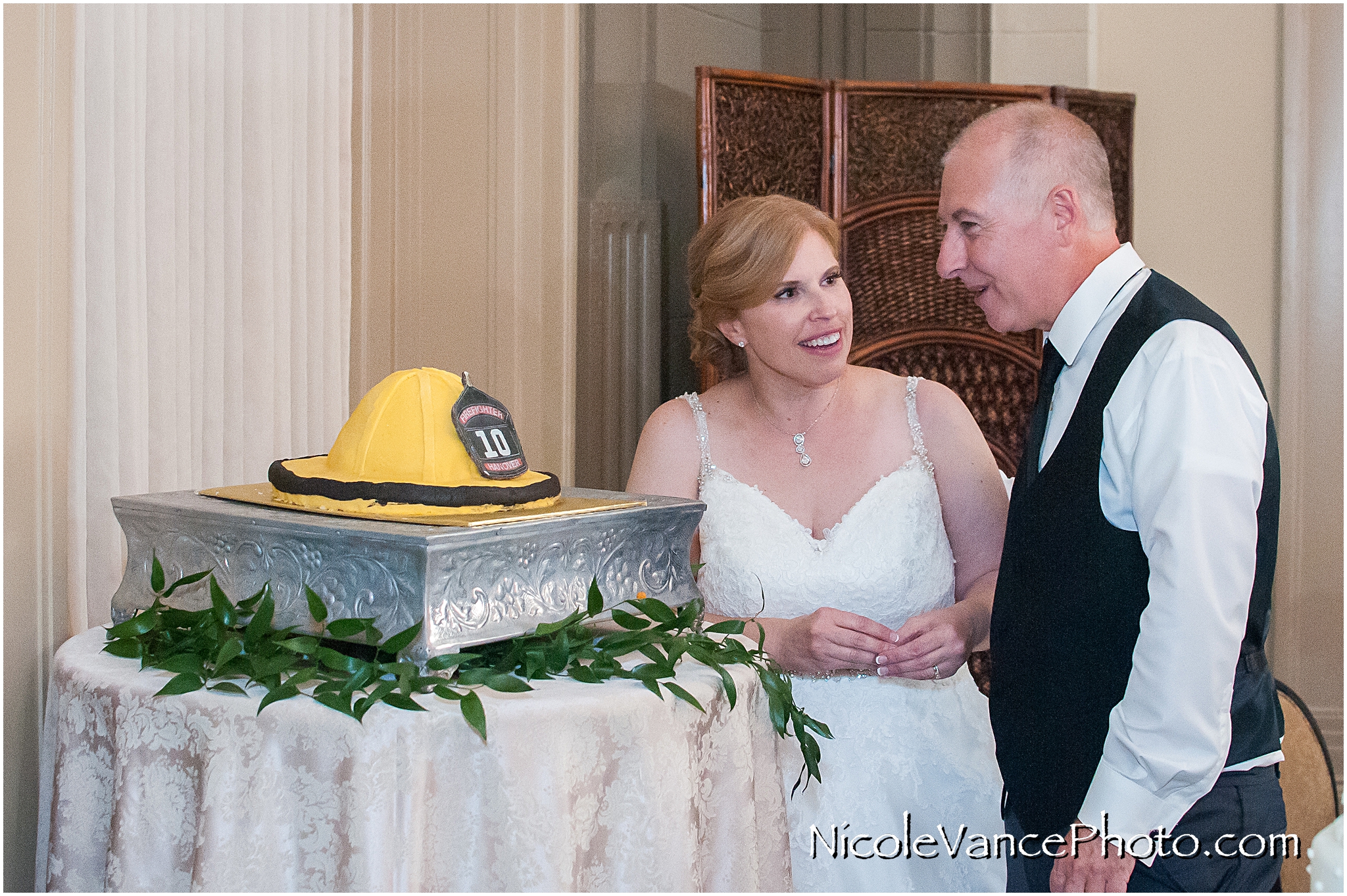 The groom sees his cake for the first time.