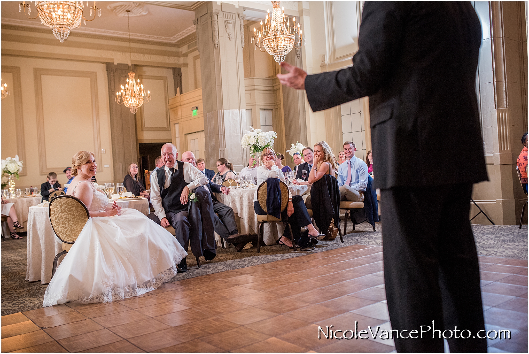 A toast to the bride and groom at the Hotel John Marshall.