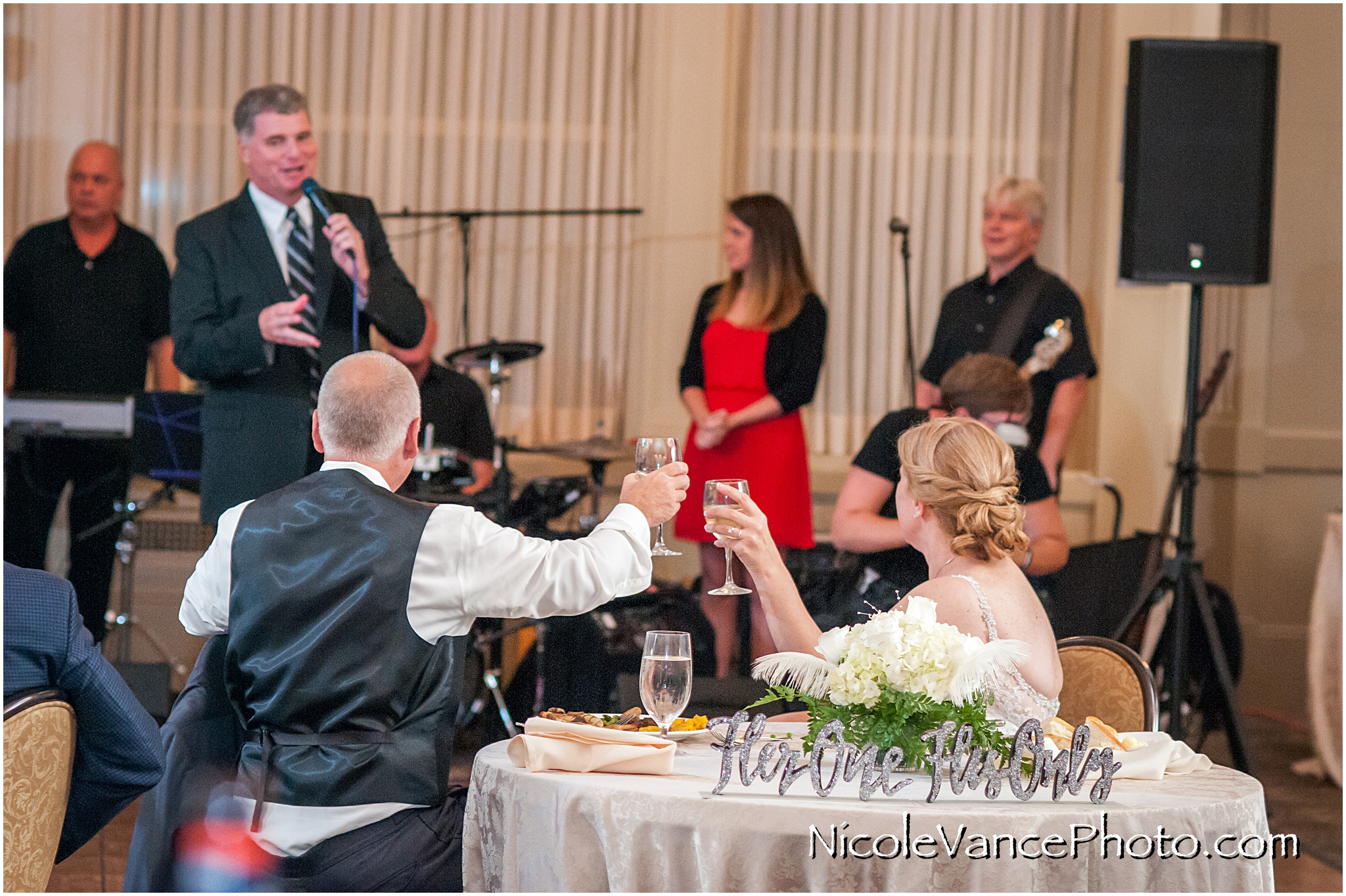 A toast to the bride and groom at the Hotel John Marshall.