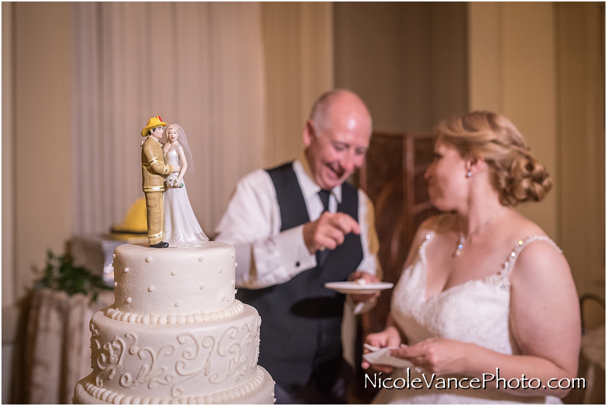 The couple enjoy their wedding cake prepared by Sugar Cain Bakery.