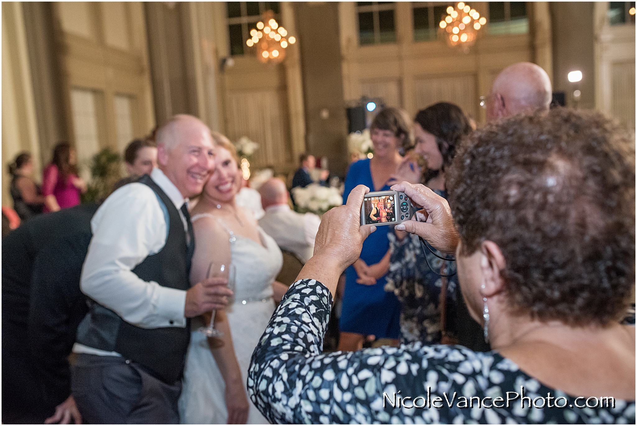 Behind the scenes during a wedding reception at the John Marshall Hotel.
