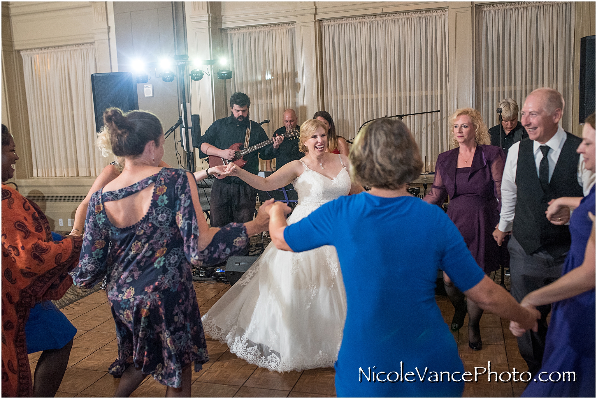 The bride and groom enjoy their reception at the Hotel John Marshall.