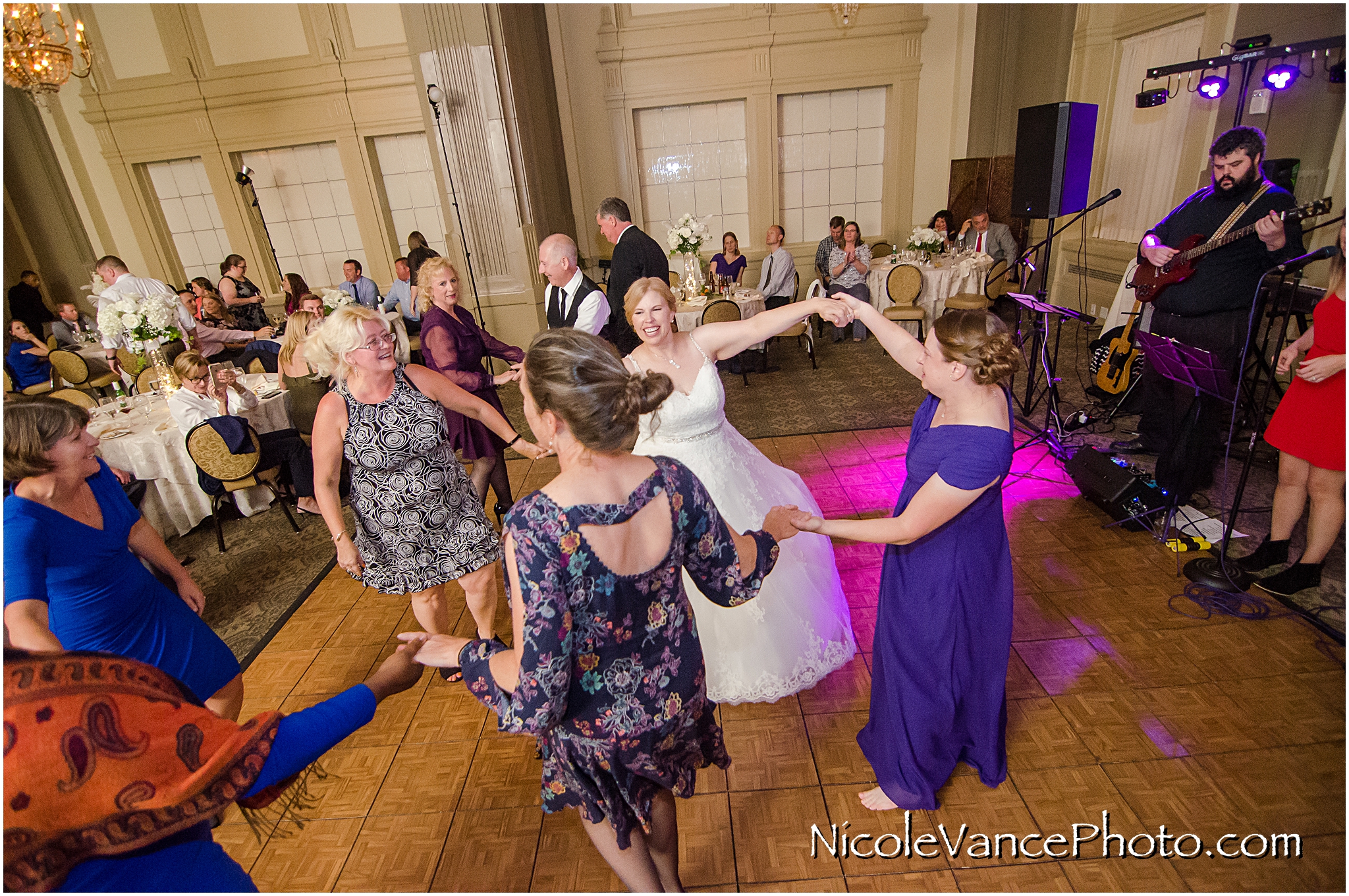 The bride and groom enjoy their reception at the Hotel John Marshall.