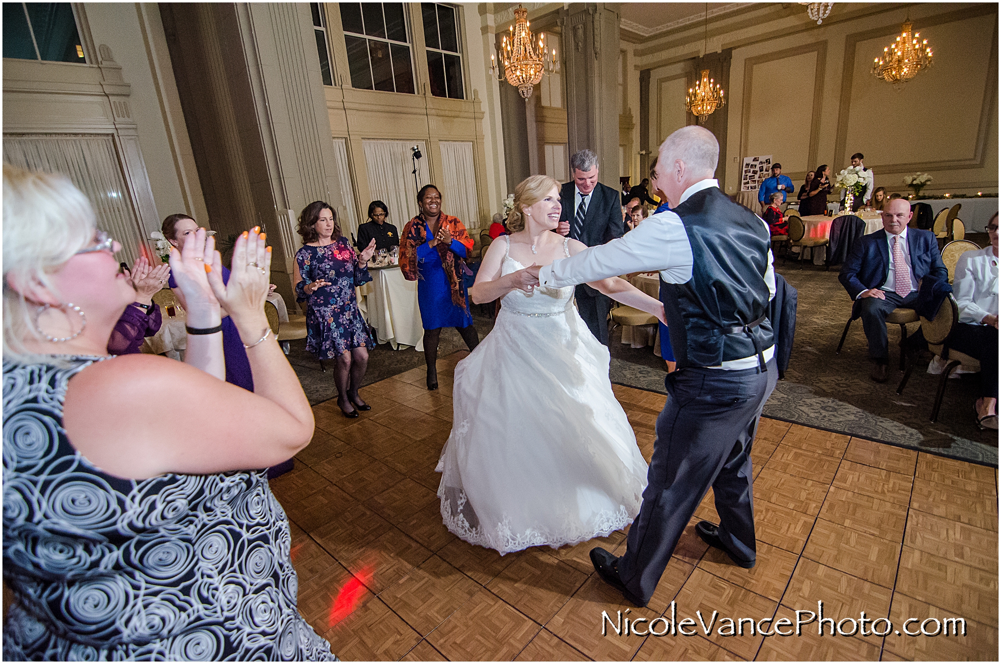 The bride and groom enjoy their reception at the Hotel John Marshall.