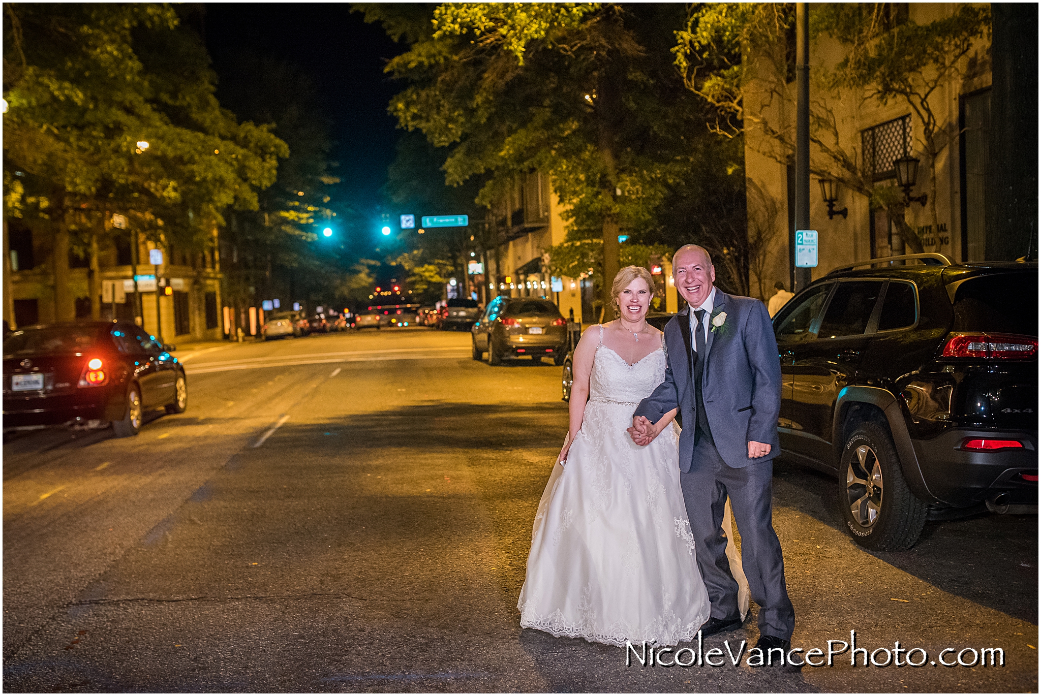 The happy couple outside on the street at the John Marshall Hotel.