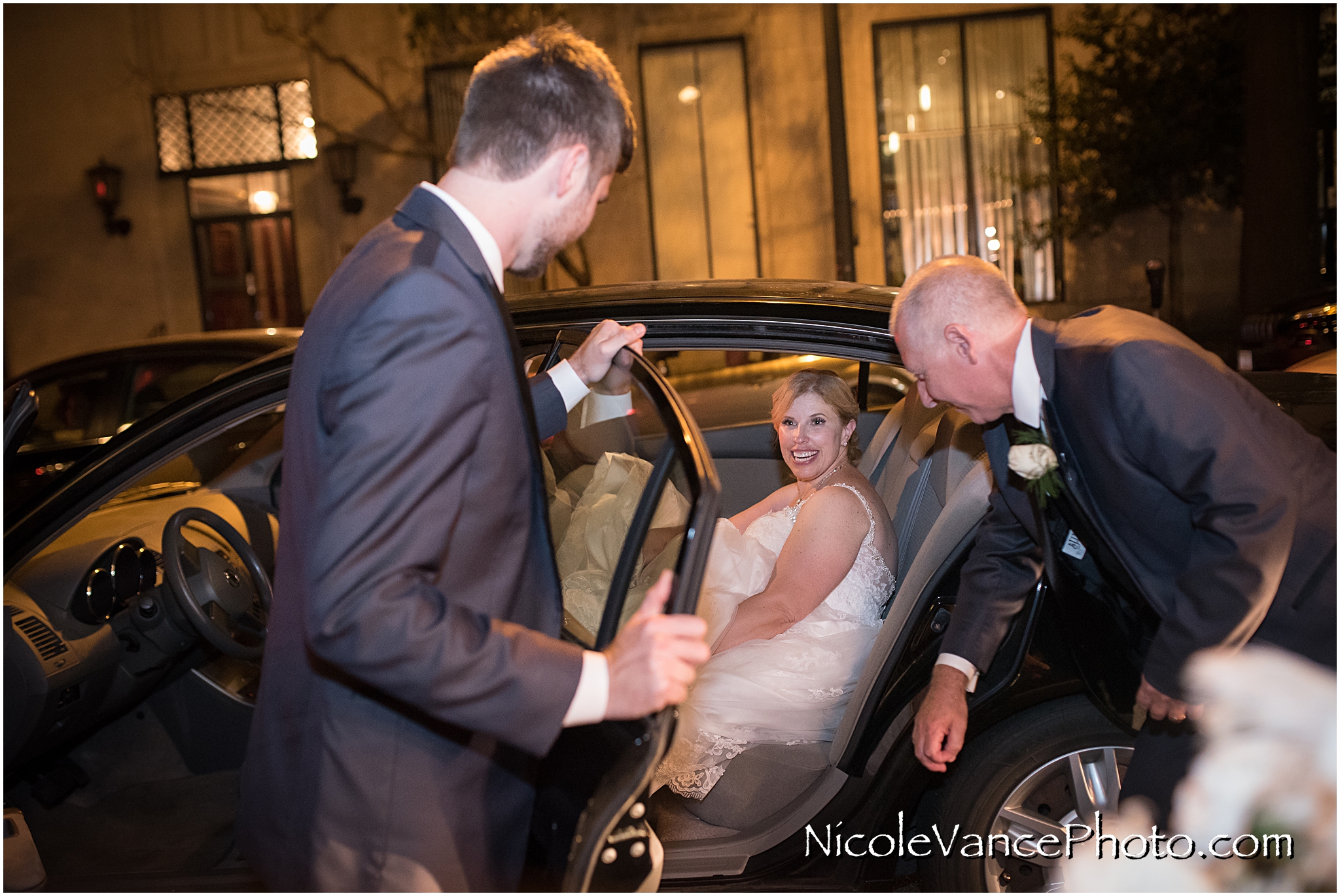 The couple say their goodbyes after their reception at the Hotel John Marshall.