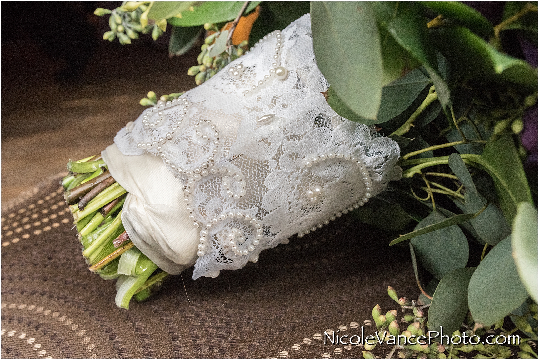 The vintage lace on the bride's bouquet is from her mother's wedding gown.