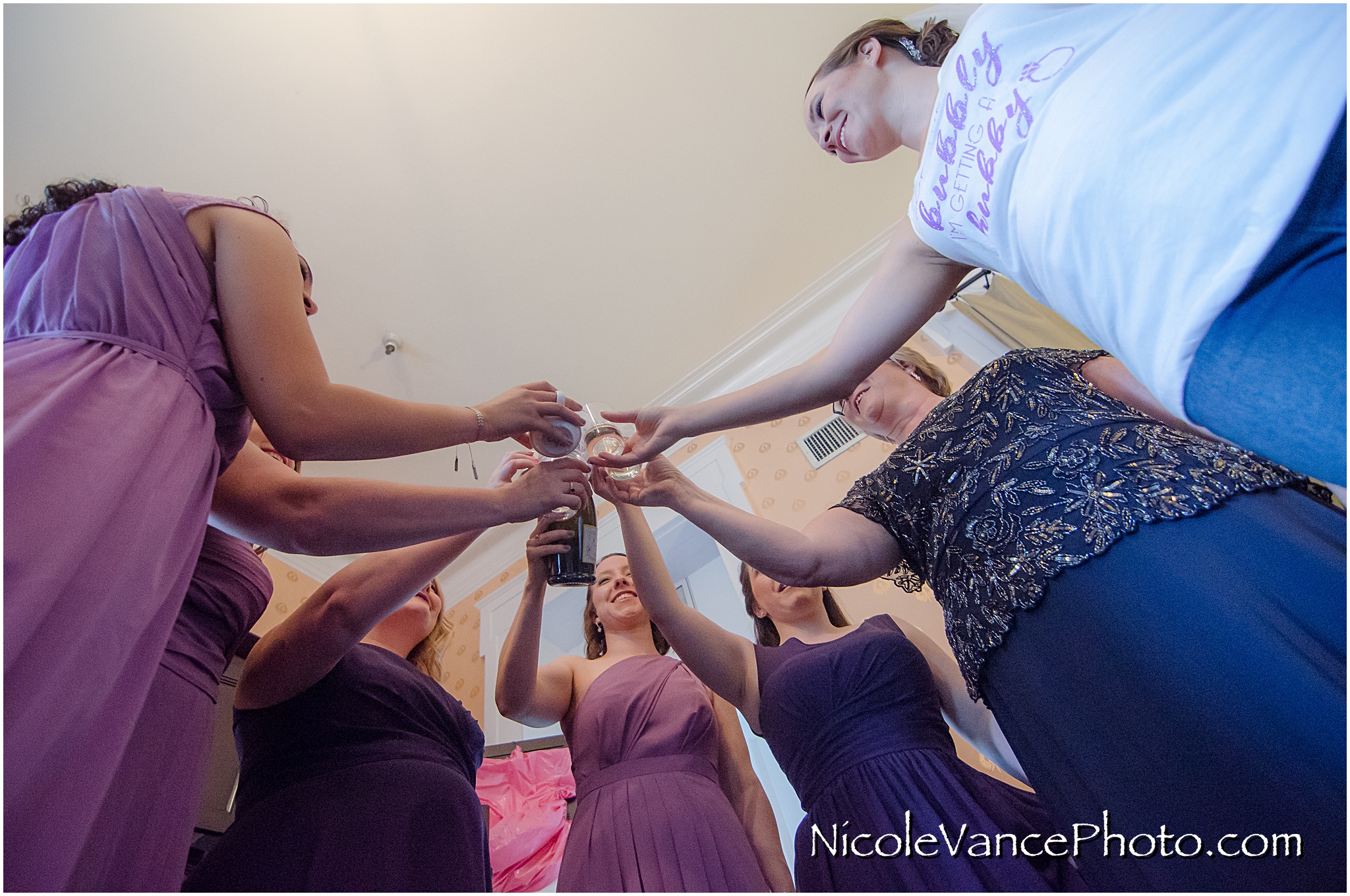 The bridesmaids toast the bride in the Bridal Suite at the Linden Row Inn.