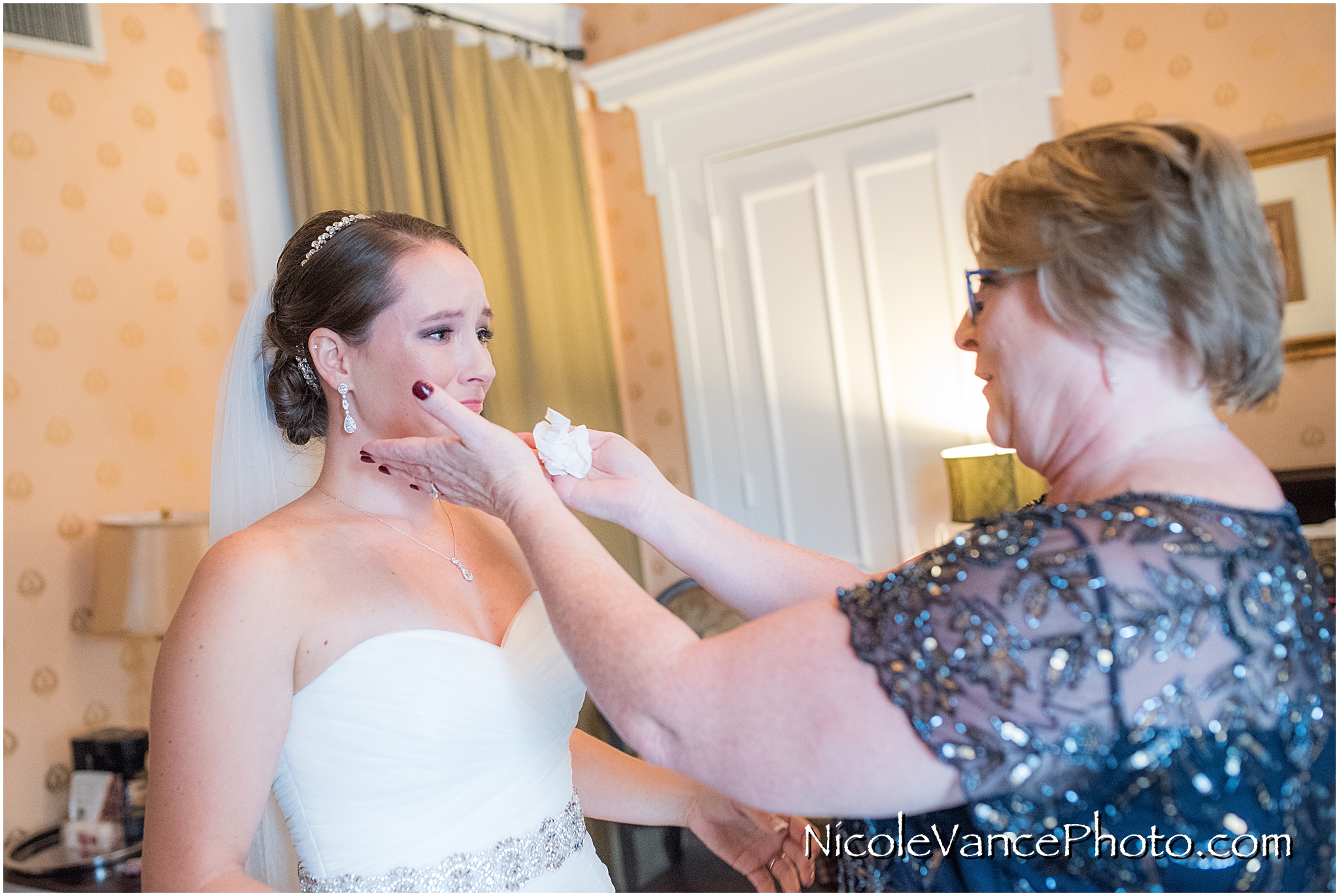 A tearful moment is shared between mom and daughter as they ready themselves to see her groom for the first time.