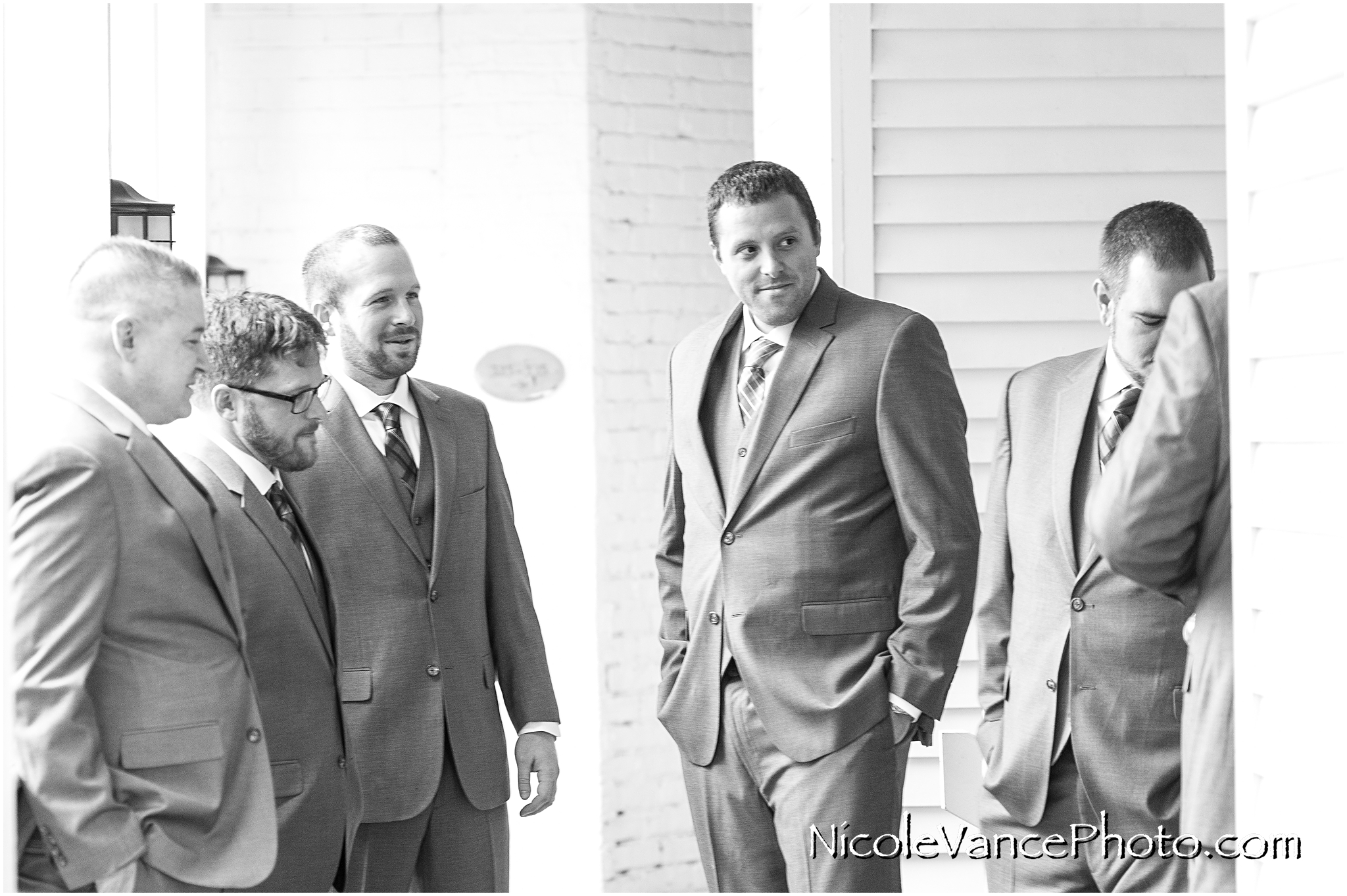 The groom enjoys a few minutes together with his groomsmen at the Linden Row Inn, in Richmond, VA.