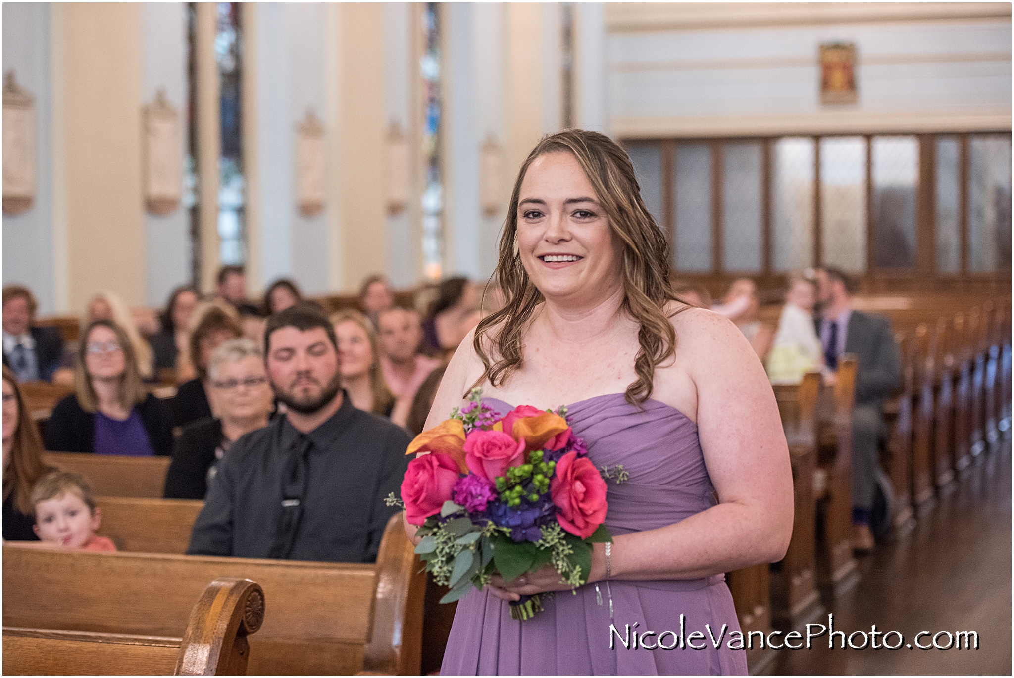 The bridesmaids make an entrance at St Peter's Catholic Church, in Richmond VA.