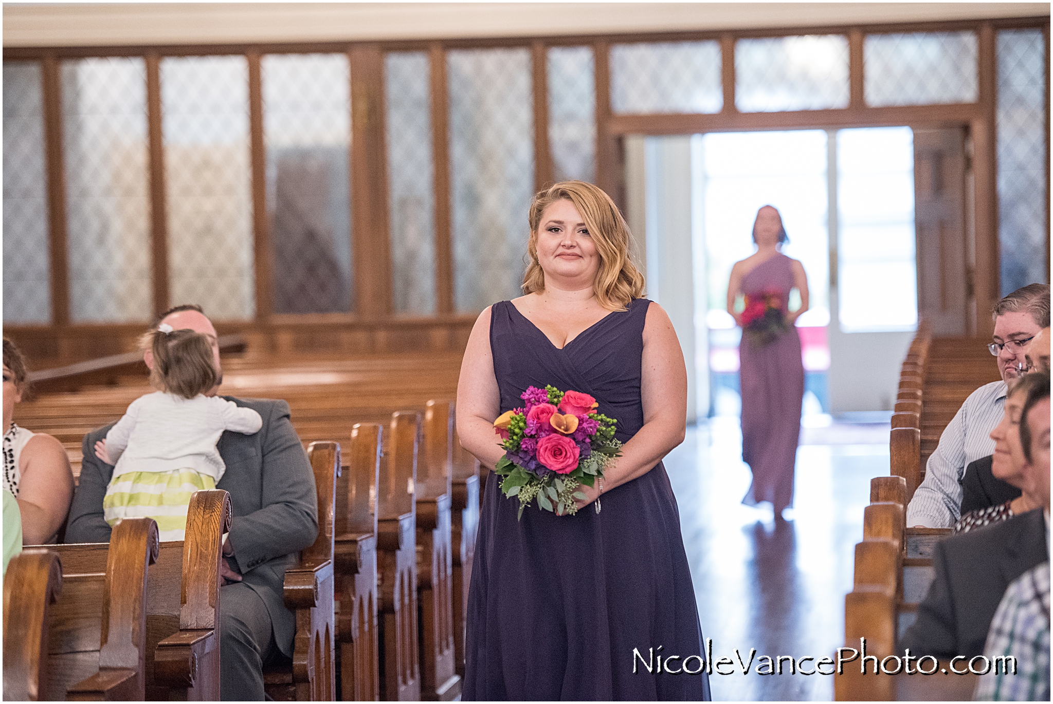 The bridesmaids make an entrance at St Peter's Catholic Church, in Richmond VA.