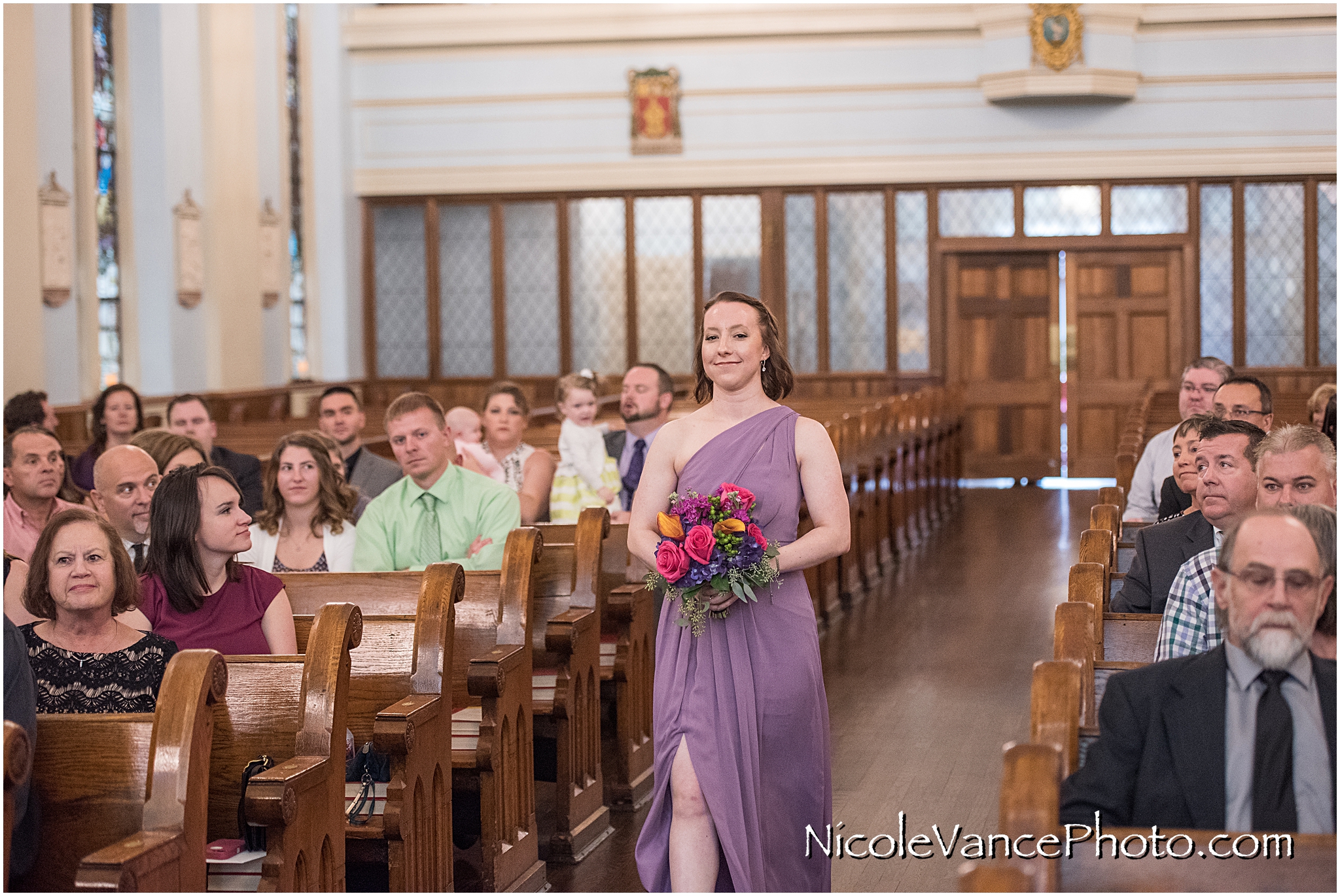 The bridesmaids make an entrance at St Peter's Catholic Church, in Richmond VA.