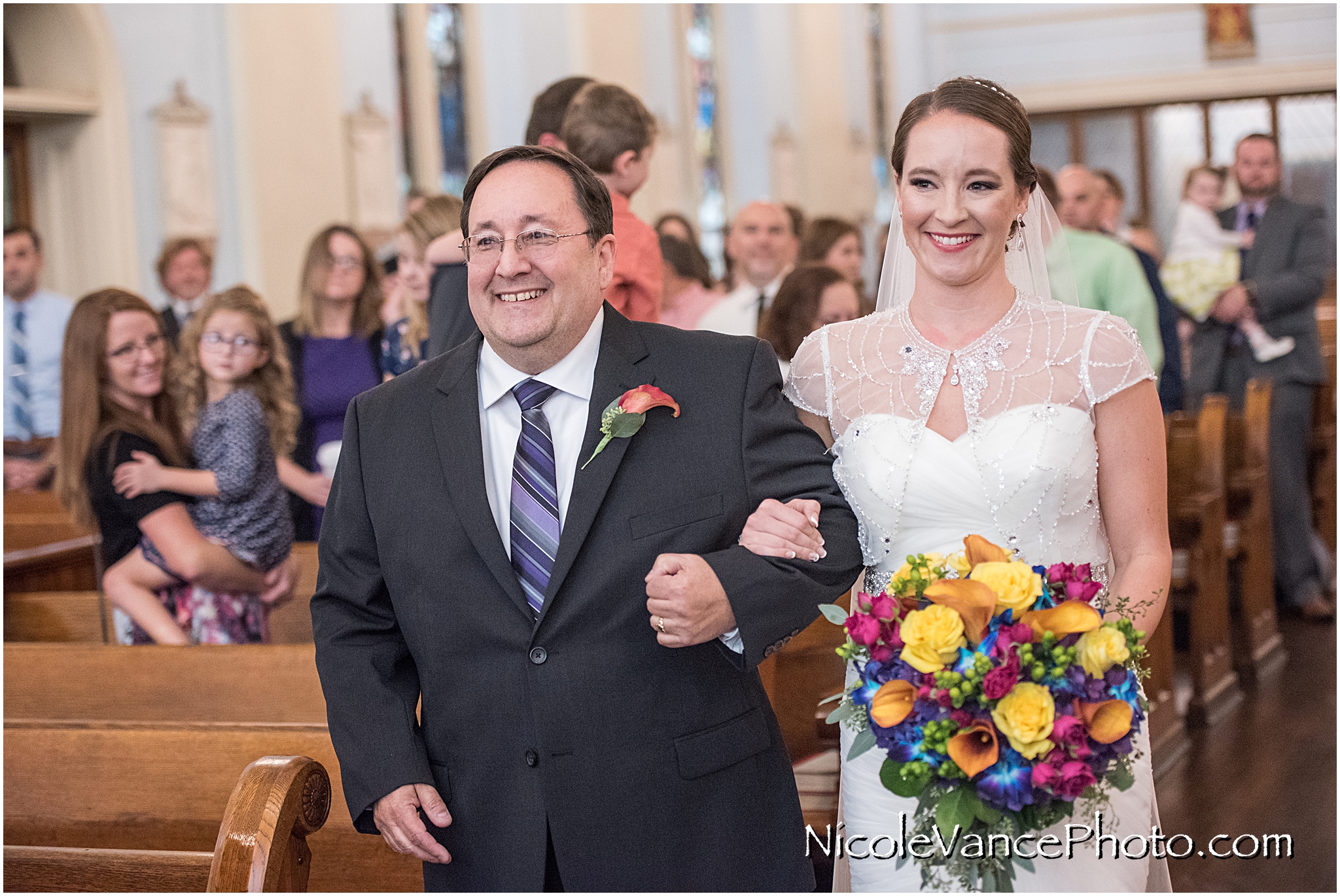 The bride makes an entrance at St Peter's Catholic Church, in Richmond Virginia.